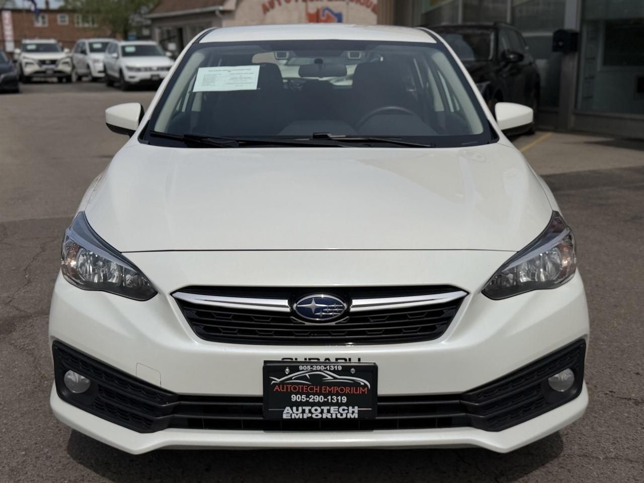 2022 Subaru Impreza Convenience AWD Pearl White w/ Eyesight Pkg   Lane Photo