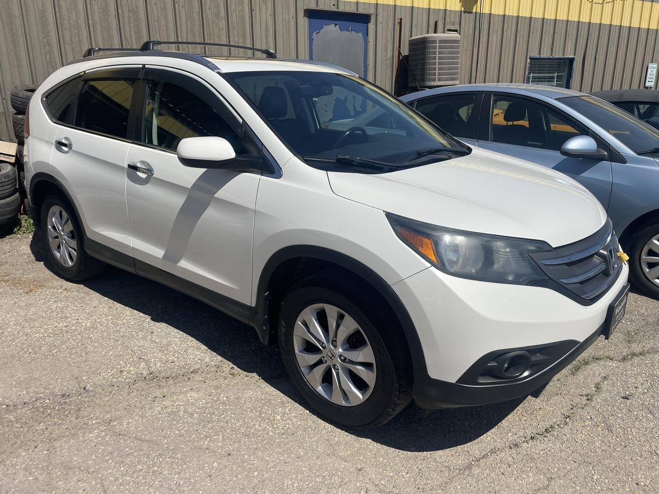 <p>Only 169,000 km on this very well kept 2012 Honda CRV Touring. Beautifully equipped with heated power seats, Blue Tooth, Navigation, cruise control panoramic sunroof, memory seating, remote start, alloy wheels, exterior finished in bright white with a black leather interior, premium condition with low kilometres,hard to find, recent service and safety completed. Priced at $15,950 plus taxes.,No other Fees! Luxury, <span style=mso-spacerun: yes;>&nbsp;</span>Performance and Economy! Comfortable and spacious interior with lots of cargo space. Good car history with no major accidents, Just serviced and safetied, As part of our full disclosure policy a Carfax report comes with every vehicle.<span style=mso-spacerun: yes;>&nbsp; </span>Call today to set up an appointment to view and test drive. Call today to set up an appointment to view and test drive. Westside Sales Ltd.<span style=mso-spacerun: yes;>&nbsp; </span>1461 Waverley Street 204 488 3793. Buy with confidence, We are one of the most established used car dealerships in Winnipeg. Come check us out... theres a reason we have been around since 1985 at the same location.<span style=mso-spacerun: yes;>&nbsp; </span>See our other great deals at WWW.Westsidesales.CA Apply for financing on our website.<span style=mso-spacerun: yes;>&nbsp; </span>Check us out on facebook and instagram @westsidesale<span style=mso-spacerun: yes;>&nbsp;&nbsp; </span>DP#9491</p>