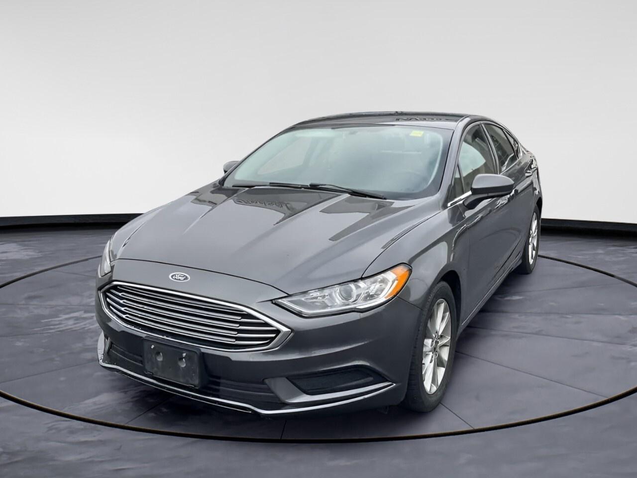 Magnetic 2017 Ford Fusion S FWD 6-Speed Automatic 2.5L iVCT

**CARPROOF CERTIFIED**, 6-Speed Automatic.

This vehicle is being sold "as is," unfit, not e-tested and is not represented as being in road worthy condition, mechanically sound or maintained at any guaranteed level of quality. The vehicle may not be fit for use as a means of transportation and may require substantial repairs at the purchasers expense.


Awards:
  * 2017 IIHS Top Safety Pick, Top Safety Pick+   * 2017 KBB.com 10 Most Awarded Brands   * 2017 KBB.com 10 Best Sedans Under $25,000   * 2017 KBB.com Brand Image Awards