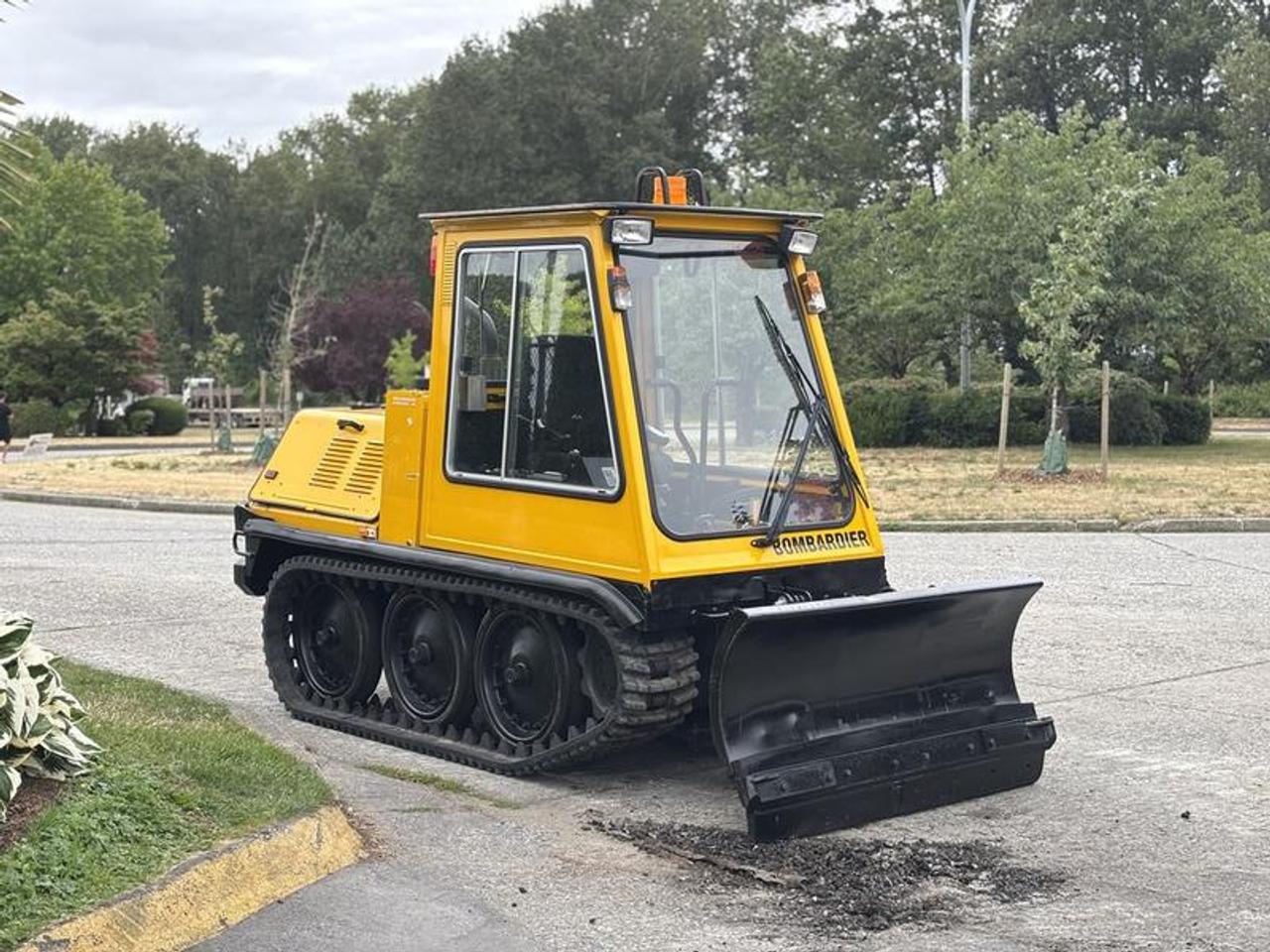 This 2004 Bombardier SW48 ME is powered by a 4.4L 4-cylinder diesel engine paired with an automatic transmission and a tracked undercarriage. Designed for snow removal operations, this tracked snow plow is suited for clearing sidewalks, pathways, parking areas, and other locations where traction and maneuverability are essential in winter conditions.

The machine has a gross operating weight of approximately 2,495 kg (5,490 lbs) and is equipped with a 58-inch Bombardier straight snow plow blade for snow clearing and maintenance operations. The tracked design provides improved flotation and traction on snow and ice compared to conventional wheeled equipment.

The enclosed cab is equipped with fan and heat, sliding windows, AM/FM radio, and strobe/work lights to enhance operator comfort and visibility during winter operations.

Finished in yellow with a black vinyl interior, this Bombardier SW48 ME provides a compact tracked snow plow platform suitable for municipal, commercial, and property maintenance applications. This item is currently OFFSITE. You must register an appointment with our office to schedule an offsite viewing. Appointments must be made a minimum of one business day in advance (and as defined by the days that Repo.com is open for business) before your appointment can be scheduled and confirmed. We may, at our own discretion, instead opt to transport smaller items to Repo.coms main yard for viewing purposes.  $39,830.00 plus $375 processing fee, $40,205.00 total payment obligation before taxes.   Listing report, warranty, contract commitment cancellation fee, financing available on approved credit (some limitations and exceptions may apply). All above specifications and information is considered to be accurate but is not guaranteed and no opinion or advice is given as to whether this item should be purchased. We do not allow test drives due to theft, fraud, acts of vandalism and undetectable impaired driving. Instead we provide the following benefits: Complimentary Warranty (with options to extend), Limited Money Back Satisfaction Guarantee on Fully Completed Contracts, Contract Commitment Cancellation, and an Open-Ended Sell-Back Option. Ask seller for details or call 604-522-REPO(7376) to confirm listing availability.