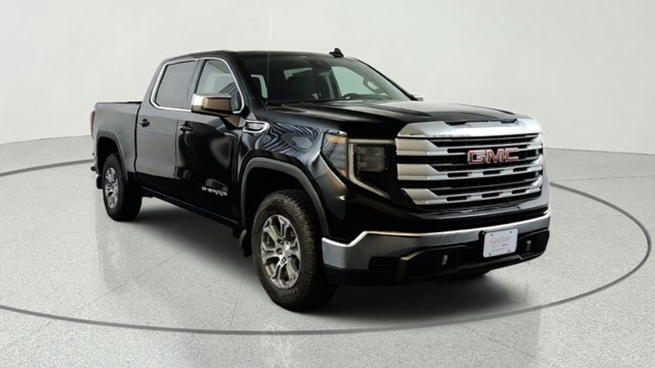 The 2026 GMC Sierra 1500 SLE is a mid-level full-size pickup that combines comfort, technology, and capability in a versatile package. It comes standard with a large 13.4-inch multicolor touchscreen infotainment system paired with a 12.3-inch driver information display, plus upgraded interior comforts like a 10-way power heated driver seat with lumbar support, heated front passenger seat, and a heated steering wheel for enhanced everyday usability. On the capability side, the SLE adds an auto-locking rear differential for improved traction and is powered by a 5.3 litre V8 engine for strong towing performance, while features like available spray-on bedliner help protect the cargo area.