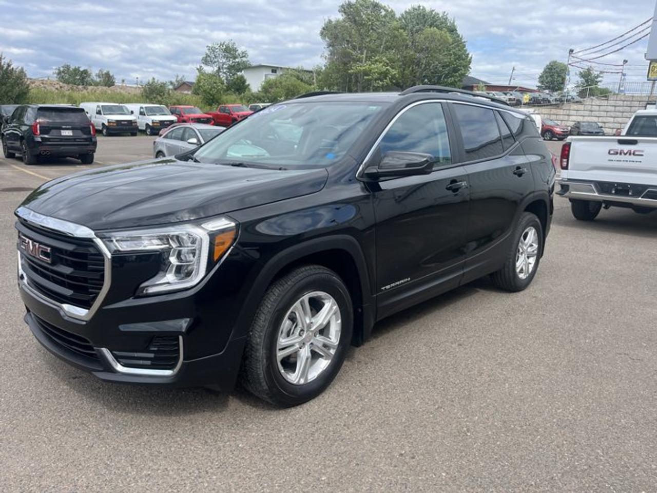 New Price!Ebony Twilight Metallic 2024 GMC Terrain SLE AWD 9-Speed Automatic 1.5L DOHCAWD, 2 USB Data Ports w/Auxiliary Input Jack, 2-Way Power Driver Lumbar Control, 3.47 Axle Ratio, 4-Way Manual Front Passenger Seat, 4-Wheel Disc Brakes, 4.2 Multi-Colour Driver Information Screen, 6 Speakers, 6-Speaker Audio System Feature, 8-Way Power Driver Seat Adjuster, ABS brakes, Air Conditioning, Alloy wheels, AM/FM radio: SiriusXM, Auto High-beam Headlights, Auto-dimming Rear-View mirror, Automatic temperature control, Bluetooth® For Phone, Brake assist, Bumpers: body-colour, Compass, Delay-off headlights, Driver & Front Passenger Heated Seats, Driver door bin, Driver vanity mirror, Dual front impact airbags, Dual front side impact airbags, Electronic Stability Control, Emergency communication system: OnStar and GMC connected services capable, Engine Block Heater, Four wheel independent suspension, Front anti-roll bar, Front Bucket Seats, Front dual zone A/C, Front reading lights, Fully automatic headlights, Heated door mirrors, Heated front seats, Illuminated entry, Low tire pressure warning, Not Equipped w/Seasonal Lower Grille Cover, Occupant sensing airbag, Outside temperature display, Overhead airbag, Overhead console, Panic alarm, Passenger door bin, Passenger vanity mirror, Power door mirrors, Power driver seat, Power steering, Power windows, Preferred Equipment Group 3SA, Premium audio system: GMC Infotainment System, Premium Cloth Seat Trim, Radio data system, Radio: GMC Infotainment Audio System w/7 Display, Rear anti-roll bar, Rear window defroster, Rear window wiper, Remote keyless entry, Roof rack: rails only, Security system, SiriusXM, Speed control, Speed-sensing steering, Split folding rear seat, Spoiler, Steering wheel mounted audio controls, Tachometer, Telescoping steering wheel, Tilt steering wheel, Traction control, Trip computer, Variably intermittent wipers, Wheels: 17 x 7 Silver Painted Aluminum, Wireless Apple CarPlay/Wireless Android Auto.At Steele GMC Buick Fredericton, were proud to be your Used Car Mega Center serving drivers all across Atlantic Canada from Fredericton, Oromocto, New Maryland, Woodstock, Saint John, and Moncton in New Brunswick, to Nova Scotia, Prince Edward Island, and Newfoundland. Our inventory features all makes and models of used cars, trucks, SUVs, and vans, giving you the best selection in the region. Whether you need a fuel-efficient sedan, a family SUV, or a rugged pickup, youll find it right here at Steele GMC Buick Fredericton. With our Market Value Pricing, every vehicle is priced based on real-time market conditions, ensuring you get the best possible deal without the hassle of negotiating. We keep pricing transparent and competitive so you can shop with total confidence. No matter your credit situation good, bad, or no credit at all youre approved. Our finance experts work with lenders across Atlantic Canada to find the best terms for your budget, including second-chance financing, newcomer programs, and credit rebuilding solutions. As part of Steele Auto Group, Atlantic Canadas most diversified automotive group with 47 dealerships representing 27 brands, we offer unmatched selection, buying power, and customer support. That means if the vehicle you want isnt on our Fredericton lot, we can source it quickly from our massive dealer network across the Maritimes. When it comes to used vehicles, Steele GMC Buick Fredericton is the destination for drivers all across Atlantic Canada delivering market value pricing, every make and model, and guaranteed credit approval so you can get on the road with confidence.Steele Auto Group is the most diversified group of automobile dealerships in Atlantic Canada, with 47 dealerships selling 27 brands and an employee base of well over 2300.