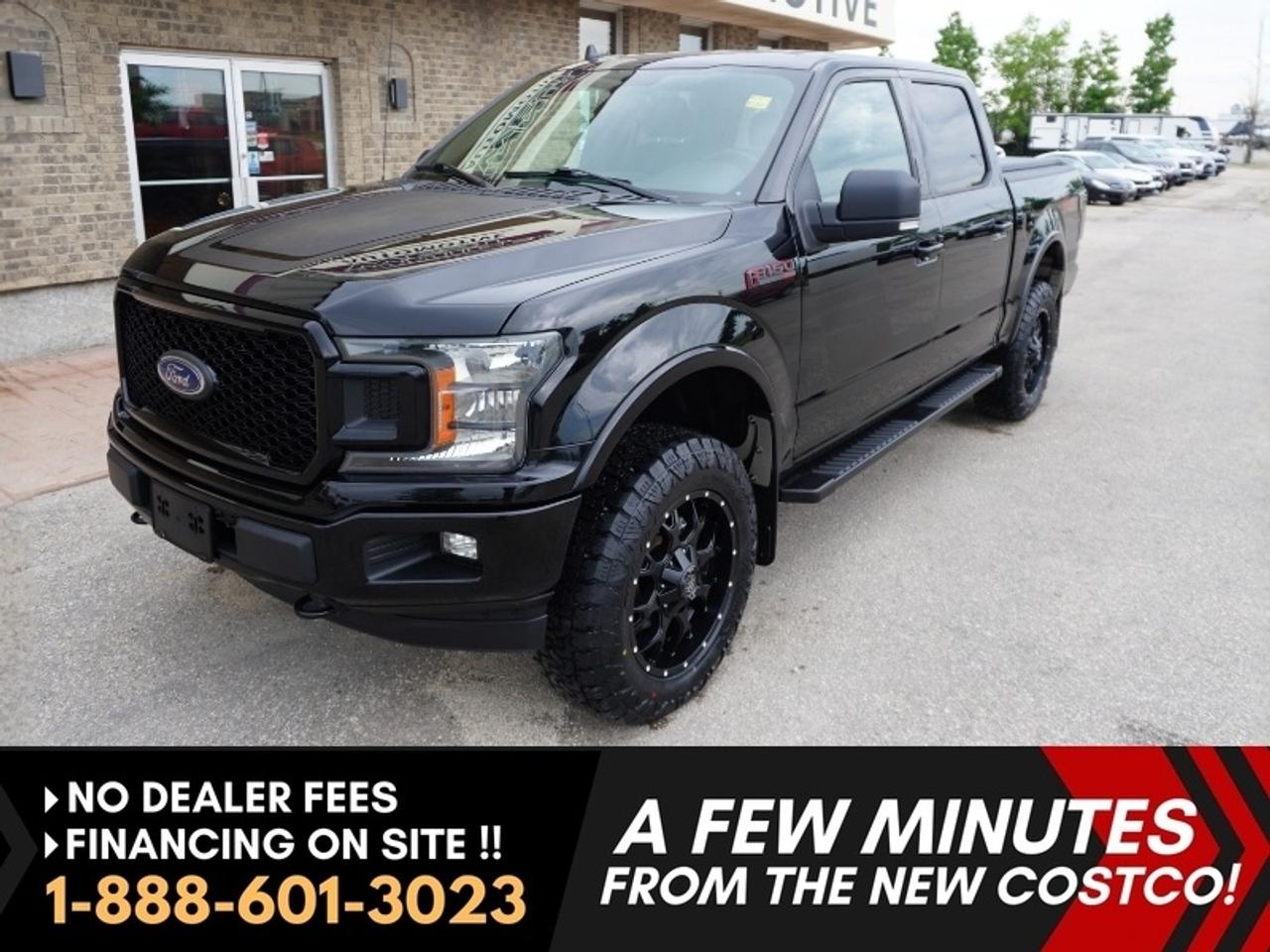 NO ADMINISTRATION FEES!!*** Dealer arranged financing on site! Quick, Simple, no calls or waiting on bank appointments required!! Drive away today ***   

NOTE: Optional brand-new aftermarket tire and wheel package available for purchase if desired (pictured). Original tires and wheels come with vehicle at advertised price.

SPECIAL EDITION 2018 Ford F-150 FX4 Sport package SuperCrew - - XLT SPORT PACKAGE - FX4 OFF-ROAD PACKAGE!!! - - 5.0L ***COYOTE*** V8 Engine - - 10-speed transmission - - Remote Start - - Rear view camera - - Navigation - - Remote Keyless Entry - - Cruise Control - - 10-way power-adjustable driver and passenger seats - - Sync 3 Infotainment system - - Bluetooth - - Sirius XM Capability- - Heated/Power Mirrors - - Power Doors - - Full length running boards - - Line-X Spray-On Truck Bedliner - - Integrated trailer brake control - - Power Sliding Rear Window - - Color Matched Bumpers - - Color Matched Handles

No money was spared on making this unit stand out from the others... Sharp Shadow Black exterior. Unique Sport hood and side decals. Black honeycomb grille, blacked out 6-inch oval Ford step bars.   Ebony black interior with red accent stitching. Ready lift installed with optional brand new 20 Mayhem blacked out rims with amp A/Tp tires, aftermarket exhaust, aftermarket upgraded LED headlights, aftermarket rear LED brake lights, spray-in liner with a tonneau cover. Pride from the previous owner went into this truck, and it shows in all areas. . .Not a work truck, not abused, more like a show truck.  

RARE! HARD TO FIND BLACK BEAUTY Locally owned and locally serviced, Impeccable service history, absolutely immaculate shape. Low KMS ONLY 72,000kms!! A truck loaded with features and ready for serious adventure. A must-see!!! 

Features
Ranked #1 for overall value
- XLT SPORT PACKAGE
- XLT SPECIAL EDITION PACKAGE
- FX4 OFF-ROAD PACKAGE
- 302A LUXURY PACKAGE
- 5.0L Coyote V8 
- Navigation
- Ford SYNC 3 infotainment
- AM/FM CD/MP3 
- Bluetooth
- Sirius XM Capability
- A/C
- ABS 
- Cruise Control
- Engine block heater
- Rear view camera
- Remote Keyless Entry
- Selectshift automatic transmission
- Heavy-duty shocks
- Power windows
- Power doors
- Power mirrors
- Remote Start
- SYNC 3 
- Boxlink cargo system
- Power sliding rear window
- Reverse sensing system
- LED Box lighting 
- FX4 OFF-Road Package
- Tailgate step
- Integrated trailer brake control
- SOS post-crash alert
- Full-length running boards
- Line-X Spray-On Truck Bedliner
- Adjustable steering wheel
- Fog lights
- Pickup tie-down hooks
- Privacy glass
- Removable tailgate
- Tow Hooks

Comes with a Manitoba Safety Certification, and we have many Extended Powertrain warrantys available on your vehicle purchase up to 10-year coverage (on eligible vehicles see dealer for details). Financing on site with Zero down financing OAC. Trades accepted. View at Winnipeg West Automotive Group, 5195 Portage Ave. (only a couple of minutes past the new Costco) Dealer permit # 6007, Call now 1(888) 601-3023. This Car is located in Winnipeg Manitoba, however we can have it shipped anywhere in North America relatively inexpensively.