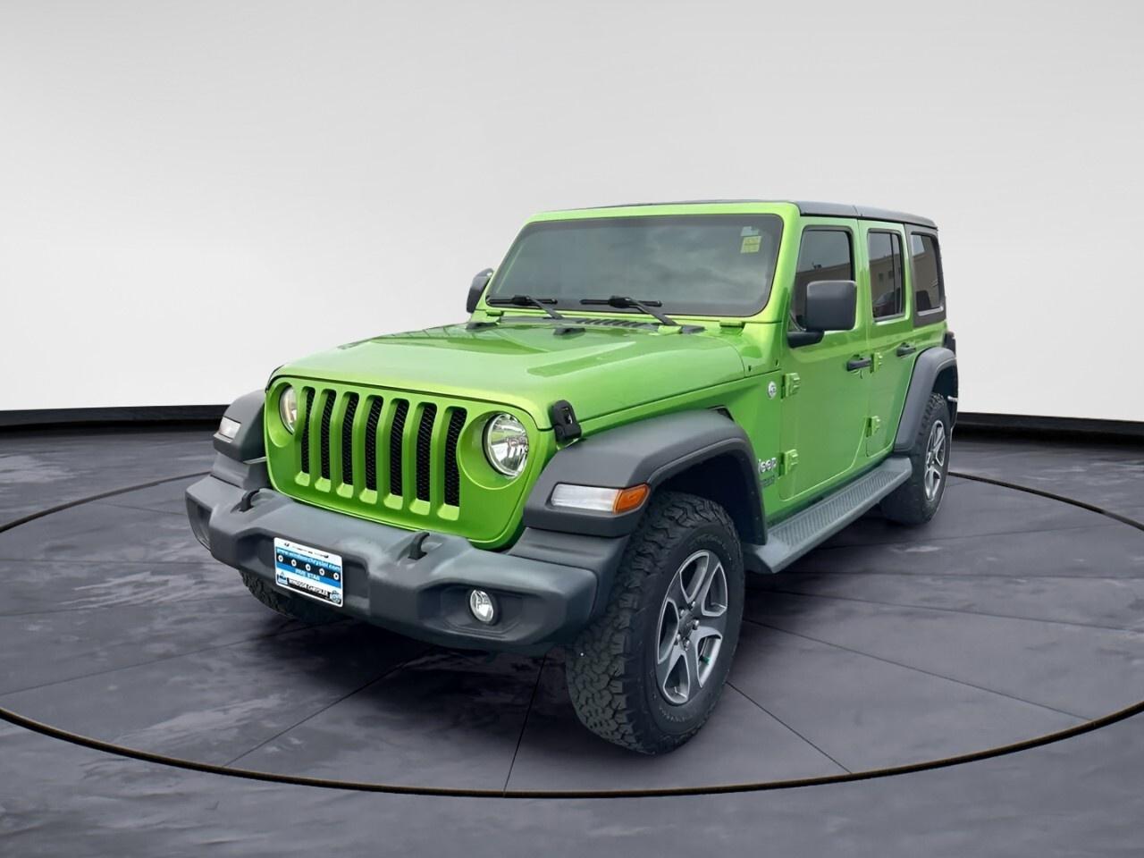 Experience the rugged charm of the 2019 Jeep Wrangler Unlimited Sport 4x4 in a robust [Color] finish. With its reliable 4x4 drivetrain and manual transmission, this SUV is designed to tackle challenging terrains with ease, making it an adventure-ready companion for outdoor enthusiasts.

The Wrangler Unlimited Sport features a timeless exterior that is sure to turn heads, paired with alloy wheels that add a touch of durability and style. Inside, enjoy the comfort of air conditioning and intuitive design that Jeep is renowned for. The spacious cabin provides ample room for passengers and gear, making it an ideal choice for both city drives and off-road escapades.

Stay connected and drive confidently with the modern technology integrated into this vehicle. A backup camera ensures safety during reverse maneuvers, while the Bluetooth connection keeps you linked to your devices on the go. The integration of cruise control and brake assist adds an extra layer of convenience and safety, enhancing your overall driving experience.

This Jeep Wrangler appeals to those seeking both adventure and style. If you&rsquo;re looking to embrace new journeys in a vehicle designed for exploration, reach out to Windsor Chrysler today for more details or to schedule a test drive. Don&rsquo;t miss the chance to make the iconic Jeep Wrangler Unlimited yours.