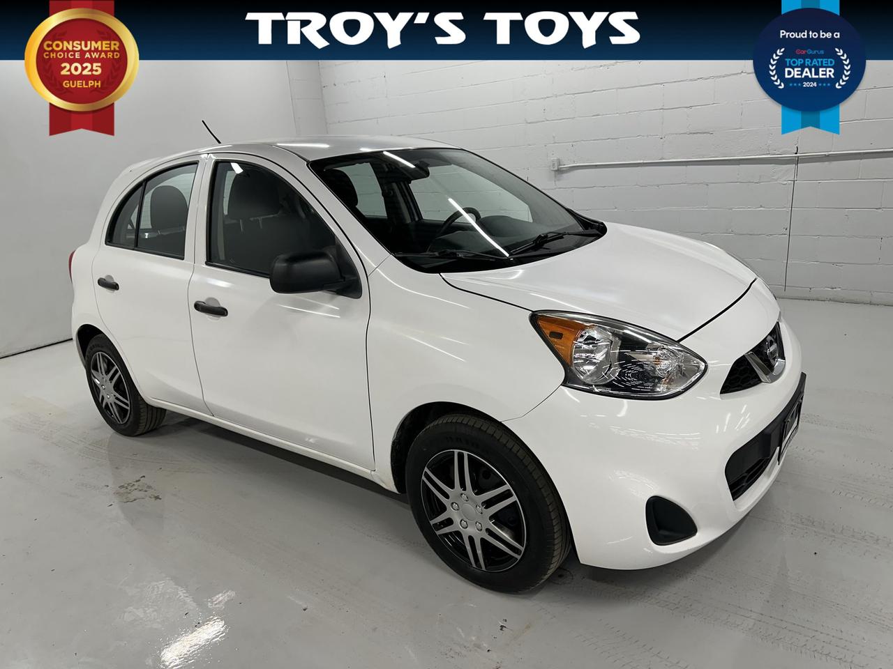 <p>Looking for an economical and nimble ride to navigate the city streets? Troys Toys has the perfect solution for you with this sharp 2015 Nissan Micra 4DR HB AUTO S. Finished in a classic white exterior and featuring a sleek black interior, this hatchback is designed for practicality without sacrificing style. Under the hood, youll find a reliable 1.6L I4 engine paired with a smooth automatic transmission, delivering an efficient and responsive driving experience. With only 44,391 km on the odometer, this Micra is ready for many more adventures.</p><p>This 2015 Nissan Micra from Troys Toys is a fantastic choice for anyone seeking a dependable and easy-to-drive vehicle. Its compact size makes parking a breeze, and the 4-door hatchback design offers surprising versatility for your daily errands, weekend getaways, or hauling groceries. Whether youre a first-time car buyer, a city commuter, or simply looking for a budget-friendly option that&rsquo;s been well-maintained, this Micra is sure to impress.</p><p>Here are five sizzling features of this 2015 Nissan Micra at Troys Toys:</p><ul><li><strong>Effortless Automatic Transmission:</strong> Enjoy a smooth and convenient driving experience with the automatic transmission, making stop-and-go traffic and everyday driving a breeze.</li><li><strong>Nimble Hatchback Design:</strong> The 4-door hatchback body style provides exceptional practicality and easy access, perfect for urban living and hauling your essentials.</li><li><strong>Fuel-Efficient 1.6L Engine:</strong> Experience impressive fuel economy without compromising on performance, keeping your running costs low and your adventures going.</li><li><strong>Low Kilometerage:</strong> With only 44,391 km, this Micra has plenty of life left, offering you peace of mind and years of reliable service.</li><li><strong>Classic White Exterior & Black Interior:</strong> A timeless colour combination that offers a clean, crisp look thats always in style, and a sophisticated interior to match.</li></ul><p><strong><em>Powered by AutoIntelligence&trade;</em></strong></p><p>Vehicle information has been generated using artificial intelligence and is provided for informational purposes only. While efforts are made to ensure accuracy, please confirm all details directly with the dealer.</p>