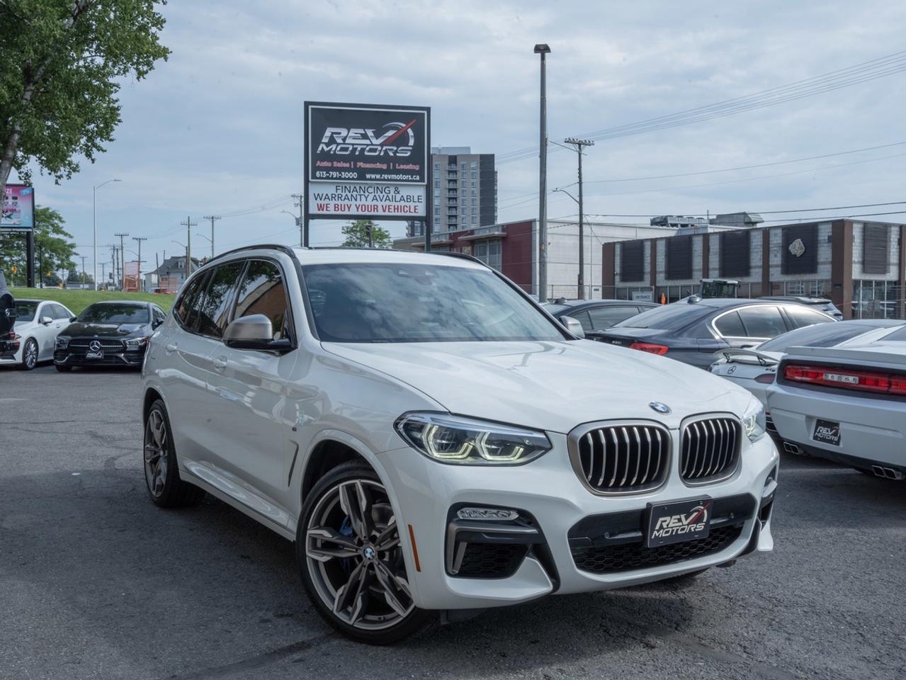 2018 BMW X3 M40i | Premium Enhanced Package | AWD | Apple CarPlay<br/> <br/> Alpine White Exterior | Cognac Interior | LED Headlights | Panoramic Sunroof | Heated Front Seats | Heads-Up Display | Heated Steering Wheel | Keyless Start | Leather Seats | Tri‑Zone Climate Control | Power Tailgate | iDrive Touchscreen | Apple CarPlay | Navigation | Harman Kardon Audio | Parking Sensors | Rearview Camera | Blind Spot Monitoring | 3.0L TwinPower Turbo Inline‑6 | 355 Horsepower | 8‑Speed Sport Automatic | xDrive AWD | and more <br/> <br/> <br/> The 2018 BMW X3 M40i blends athletic performance with premium comfort, making it one of the most desirable compact luxury SUVs of its era. With its clean White exterior and warm Tan interior, this M40i delivers a refined yet sporty driving experience backed by BMW’s signature engineering. <br/> <br/> <br/> Key Features <br/> <br/> <br/> Sporty, Modern Exterior <br/> The White finish highlights the X3’s sharp body lines, LED lighting, and M‑tuned design cues. Optional 20‑inch M Sport wheels and the panoramic sunroof add presence and sophistication. <br/> <br/> <br/> Premium Tan Interior <br/> Inside, the Tan cabin offers a warm, upscale atmosphere with high‑quality materials and excellent ergonomics. Heated front seats, a heated steering wheel, and tri‑zone climate control enhance comfort year‑round. <br/> <br/> <br/> Turbocharged Inline‑6 Performance <br/> Powered by a 3.0L TwinPower Turbo inline‑6 producing 355 hp, the X3 M40i delivers strong acceleration and smooth power delivery. The 8‑speed sport automatic transmission and xDrive AWD system provide sharp handling and confident traction in all conditions. <br/> <br/> <br/> Advanced Technology & Connectivity <br/> The iDrive touchscreen integrates Apple CarPlay, navigation (if equipped), Bluetooth audio, and BMW’s intuitive interface. Optional Harman Kardon audio adds premium sound quality. <br/> <br/> <br/> Safety & Driver Assistance <br/> Equipped with Blind Spot Monitoring, Parking Sensors, a rearview camera, and multiple stability systems, the M40i offers strong safety and driver‑assistance capability. <br/> <br/> <br/> The 2018 BMW X3 M40i is a refined, powerful, and well‑equipped luxury SUV designed for drivers who want performance, comfort, and modern tech in a compact package. <br/> <br/> <br/> This Vehicle Has Travelled 91,791 Kms. <br/> <br/> <br/> *** NO additional fees except for taxes and licensing! *** <br/> <br/> <br/> *** 100-point inspection on all our vehicles & always detailed inside and out *** <br/> <br/> <br/> RevMotors is at your service to ensure you find the right car for YOU. Even if we do not have it in our inventory, we are more than happy to find you the vehicle that you are looking for. Give us a call at 613-791-3000 or visit us online at www.revmotors.ca <br/> <br/> <br/> Ça nous donnera du plaisir de vous servir en Français aussi! <br/> <br/> <br/> CERTIFICATION * As per OMVIC regulations - this vehicle is being sold AS-IS and is not considered road worthy - Certification / Safety is available for $899. <br/> FINANCING AVAILABLE * RevMotors offers competitive finance rates through many of the major banks. Should you feel like youve had credit issues in the past, we have various financing solutions to get you on the road. We accept No Credit - New Credit - Bad Credit - Bankruptcy - Students and more!! Please keep in mind the default loan structure found on the vehicle page is a template. The exact rate and terms that a vehicle qualifies for may differ. All quotes are subject to lender approval. <br/> EXTENDED WARRANTY * For your peace of mind, if one of our used vehicles is no longer covered under the manufacturer’s warranty, RevMotors will provide you with a 6 month / 6000KMS Limited Powertrain Warranty. You always have the options to upgrade to more comprehensive coverage as well. Well be more than happy to review the options and chose the coverage thats right for you! <br/> TRADES * Do you have a Trade-in? We offer competitive trade in offers for your current vehicle! <br/> SHIPPING * We can ship anywhere across Canada. Give us a call for a quote and we will be happy to help! <br/> <br/> <br/> Buy with confidence knowing that we always have your best interests in mind! <br/>