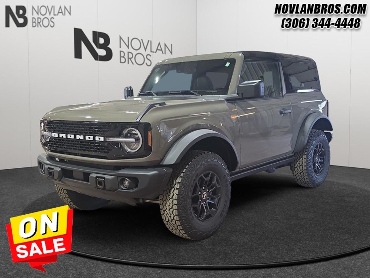 <b>Remote Engine Start, Black Appearance Package!</b><br> <br> Check out our great inventory of new vehicles at Novlan Brothers!<br> <br>The 2026 Ford Bronco integrates advanced driver-assist technology and terrain-adaptive features to keep you confident wherever you go.<br> <br>The 2026 Ford Bronco brings adventure to life with its rugged design, intelligent features, and customizable configuration that adapts to off-road landscapes or city escapes. Inside, the cabin features durable materials, intuitive tech and seating tailored for both driver and passengers in every journey. With its strong presence, forward-thinking enhancements and Fords commitment to performance, the Bronco offers a driving experience that thrives in every terrain.<br> <br>This Marsh Gray SUV has a 10 Speed Automatic transmission and is powered by a 275HP 2.3L 4 Cylinder Engine. <br> <br> Our Broncos trim level is Badlands. The cabin is built for adventure, featuring marine-grade vinyl heated bucket seats with MOLLE back straps, easy-clean rubberized flooring, and a heated leather steering wheel for all-weather comfort. The 12-inch SYNC 4 touchscreen with connected navigation, wireless Apple CarPlay, Android Auto, and voice command keeps you seamlessly connected, while the removable roof panels and rear windows let you experience every journey in the open air. Convenience features like proximity key with push-button start, dual-zone automatic climate control, and multiple power outlets blend comfort with capability. On and off the road, advanced driver-assist technologies including BLIS with Cross-Traffic Alert, Lane-Keeping Assist, Automatic Emergency Braking, and a Reverse Sensing System enhance safety and awareness. With Bilstein off-road shocks, full-time 4x4 capability and six skid plates, this SUV delivers serious off-road performance and everyday usability in one adventure-ready package. This vehicle has been upgraded with the following features: Remote Engine Start, Black Appearance Package.<br><br> View the original window sticker for this vehicle with this url <b><a href=http://www.windowsticker.forddirect.com/windowsticker.pdf?vin=1FMDE9AH0TLB19905 target=_blank>http://www.windowsticker.forddirect.com/windowsticker.pdf?vin=1FMDE9AH0TLB19905</a></b>.<br> <br>To apply right now for financing use this link: <a href=http://novlanbros.com/credit/ target=_blank>http://novlanbros.com/credit/</a><br> <br/>Weve discounted this vehicle $6323. Total rebate of $4000 is reflected in the price. 5.99% financing for 84 months. <br> Payments from <b>$924.74</b> monthly with $0 down for 84 months @ 5.99% APR O.A.C. ( Plus applicable taxes - Plus applicable fees ). Incentives expire 2026-08-31. See dealer for details. <br><br><br> Come by and check out our fleet of 20+ used cars and trucks and 100+ new cars and trucks for sale in Paradise Hill.  o~o