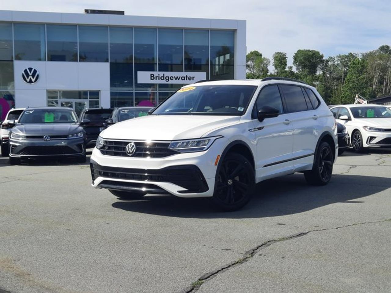 New Price! 2024 Volkswagen Tiguan Comfortline R-Line BlackAWD | Apple CarPlay | Android Auto | Sirus XM Certified.This vehicle is a Volkswagen Certified Pre-Owned (CPO) model, meeting Volkswagen Canadas certification standards for quality, reliability, and performance. Volkswagen Certified Reconditioning Includes: Comprehensive Volkswagen multi-point inspection Reconditioning completed to Volkswagen Certified standards Verification of vehicle eligibility and service history Professional detailing and final inspection Volkswagen Certified Pre-Owned vehicles include manufacturer-backed benefits. Any concerns related to the certification process must be reviewed and addressed by the original selling dealer.Oryx White AWD 8-Speed Automatic 2.0L TSI AWD, 3.533 Axle Ratio, 4-Wheel Disc Brakes, 6 Speakers, ABS brakes, Air Conditioning, Alloy wheels, AM/FM radio: SiriusXM, Auto High-beam Headlights, Auto-dimming Rear-View mirror, Automatic temperature control, Brake assist, Bumpers: body-colour, Compass, Delay-off headlights, Driver door bin, Driver vanity mirror, Dual front impact airbags, Dual front side impact airbags, Electronic Stability Control, Emergency communication system: VW Car-Net Safe & Secure (4 years included), Exterior Parking Camera Rear, Four wheel independent suspension, Front anti-roll bar, Front Bucket Seats, Front dual zone A/C, Front reading lights, Fully automatic headlights, Heated door mirrors, Heated Front Comfort Seats, Heated front seats, Heated steering wheel, Illuminated entry, Leather Shift Knob, Leather steering wheel, Leatherette Seating Surfaces, Low tire pressure warning, Occupant sensing airbag, Outside temperature display, Overhead airbag, Overhead console, Panic alarm, Passenger door bin, Passenger vanity mirror, Power door mirrors, Power driver seat, Power Liftgate, Power moonroof, Power steering, Power windows, Radio data system, Radio: 8.0 Touchscreen Infotainment System, Rain sensing wipers, Rear anti-roll bar, Rear reading lights, Rear window defroster, Rear window wiper, Remote keyless entry, Security system, Speed control, Speed-sensing steering, Split folding rear seat, Spoiler, Sport steering wheel, Standard Suspension, Steering wheel mounted audio controls, Tachometer, Telescoping steering wheel, Tilt steering wheel, Traction control, Trip computer, Turn signal indicator mirrors, Variably intermittent wipers, Wheels: 8.5J x 19 Valencia Black Alloy.