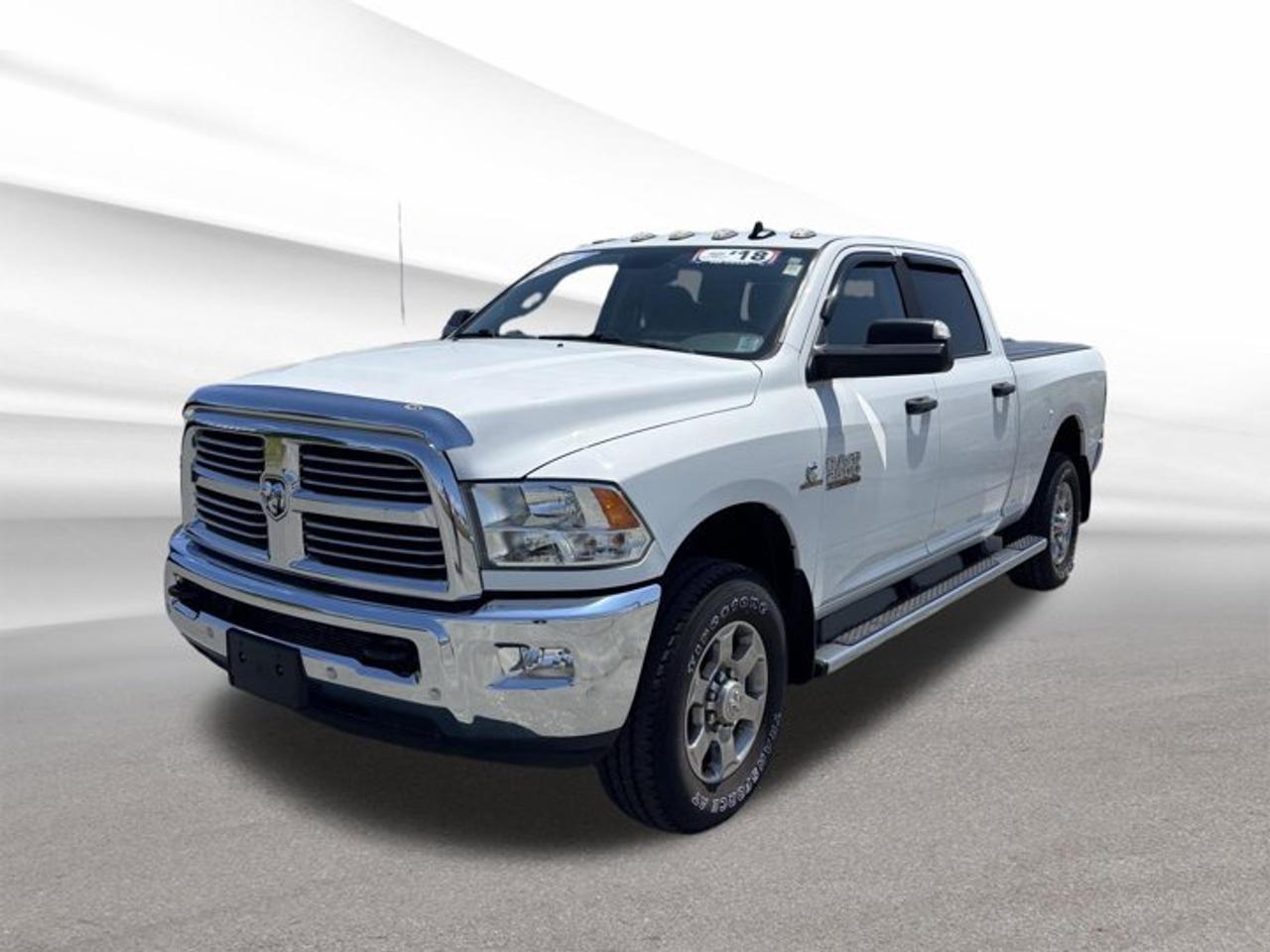 Built for serious work and ready for Atlantic Canada roads, this 2018 RAM 2500 SLT delivers proven diesel strength, four-wheel drive confidence, and the everyday comfort drivers want in a heavy-duty pickup. Finished in White with a Grey interior, this used truck at Steele Halifax Chrysler Dodge Jeep Ram FIAT in Halifax shows 68,161 km.The 2018 RAM 2500 SLT pairs a 6.7-litre intercooled turbo diesel I-6 engine with an automatic transmission for strong pulling power and dependable performance. With four doors, practical cabin access, and truck-focused equipment, this heavy-duty RAM is well suited for towing, job sites, long highway runs, and demanding daily use.FEATURES OF THE 2500 SLTChrome-inspired exterior trim adds bold presenceHeavy-duty cabin built for daily usePractical four-door layout aids rear accessDiesel power supports serious truck capabilityTRUCK FEATURESFour-wheel drive adds traction on rough roadsTrailer brake controller supports confident towingSide steps help cabin entry and exitAir suspension helps manage loaded drivingADVANCED SAFETY FEATURESFour-wheel drive boosts control in poor weatherFog lights improve vision in low lightAuto-dimming rearview mirror reduces night glareHeated mirrors help clear winter conditionsPERFORMANCE AND EFFICIENCY6.7-litre turbo diesel delivers strong torqueAutomatic transmission supports smooth power deliveryHeavy-duty design suits towing and haulingDiesel efficiency benefits long-distance highway travelCOMFORT AND CONVENIENCEHeated steering wheel adds cold-weather comfortRear window defroster clears frost quicklyFour full doors improve passenger accessPower outlet supports tools and devicesTECHNOLOGY AND CONNECTIVITYApple CarPlay adds familiar smartphone integrationPower outlet keeps devices charged on tripsClear controls support easy daily operationAuto-dimming mirror adds helpful driving convenienceCARGO SPACEPickup bed supports tools and equipmentHeavy-duty design suits demanding cargo tasksCabin offers room for personal itemsFour-door layout improves interior loading accessAWARDS & RECOGNITIONSBest Resale Value, Canadian Black Book, 2018Heavy Duty Truck of Texas, Texas Auto Writers, 2018WHAT OTHER OWNERS LIKEStrong diesel torque for towing confidenceComfortable ride for a heavy-duty truckFour-wheel drive for winter road assurancePractical cabin layout for work and travelThis 2018 RAM 2500 SLT stands out with the features drivers value most, including steps, heated mirrors, fog lights, air suspension, a heated steering wheel, Apple CarPlay, a rear window defroster, power outlet access, an auto-dimming rearview mirror, and a trailer brake controller. It is a smart choice for buyers who want real capability without giving up day-to-day comfort.If you need a used heavy-duty pickup that can handle tough jobs while staying comfortable on the road, this 2018 RAM 2500 SLT is ready to impress. Visit Steele Halifax Chrysler Dodge Jeep Ram FIAT in Halifax to see this dependable diesel truck in person.This 2018 RAM 2500 SLTs VIN is: 3C6UR5DL6JG386310 .We invite you to book a viewing and test drive at your earliest convenience