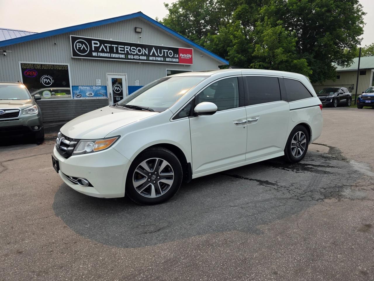 2017 Honda Odyssey Touring in White Diamond Pearl with grey leather interior - a fully-loaded, top-trim 8-passenger family van powered by the dependable 3.5L V6 with automatic transmission. Loaded with heated leather seats, power drivers seat with memory, navigation, power moonroof, tri-zone climate control with rear heat and air, dual power sliding doors, power liftgate, rear DVD entertainment system, backup camera, blind spot information, front and rear parking sensors, Bluetooth, SiriusXM satellite radio, premium audio, alloy wheels, and Hondas flexible Magic Seat 2nd- and 3rd-row seating. Stock 504256. Safety certification available and CarFax report on hand. Call today to book your test drive!
