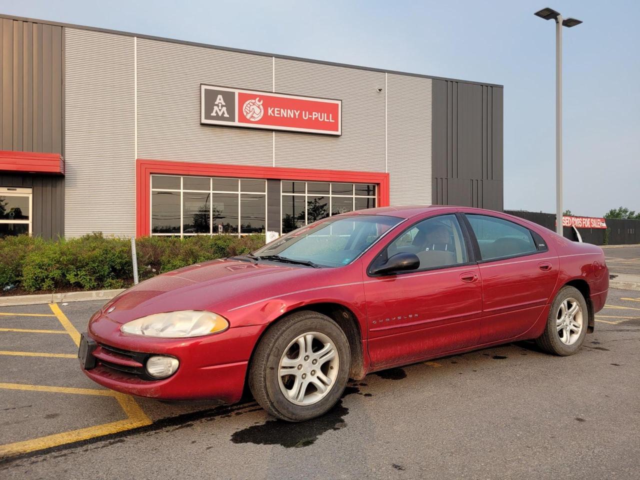 1998 Chrysler Intrepid ES in Candy Apple Red. The vehicle has 243,019km. The vehicle runs and drives. No Check engine light. Few imperfections/rust around the car, mainly the dent on the driver side fender. We dont perform any mechanical/safety inspections. The vehicle is sold as is and might need some work.