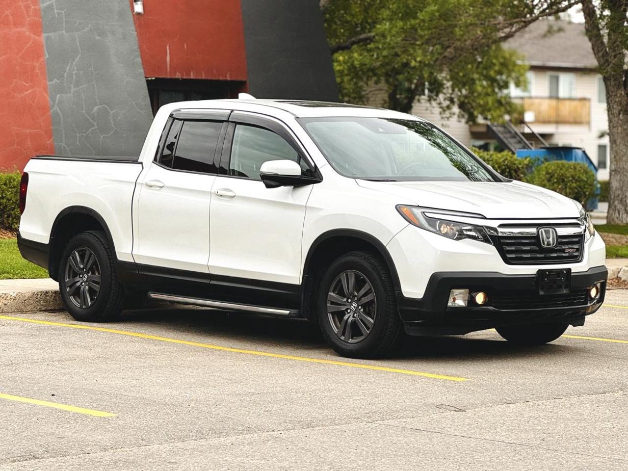 NO ACCIDENTS | 2017 Honda Ridgeline Sport AWD - Low KM Pickup Truck For Sale in Saskatoon, SK

VIN: 5FPYK3F1XHB504252
Mileage: 95,638 KM
Exterior Color: White Diamond Pearl
Interior: Premium Black Cloth
Trim: Sport AWD
Condition: No Accidents | Low Kilometres | Excellent Condition

2017 Honda Ridgeline Sport AWD for Sale in Saskatoon, Saskatchewan

If youre searching for a 2017 Honda Ridgeline Sport for sale in Saskatoon, this award-winning midsize pickup delivers legendary Honda reliability, exceptional ride quality, innovative truck features, and confident all-wheel-drive capability.

Finished in beautiful White Diamond Pearl with a durable Premium Black Cloth interior, this Ridgeline Sport is the perfect truck for everyday driving, family adventures, work, and Saskatchewan winters. Best of all, it comes with No Accident History, giving you added peace of mind.

Available now at Platinum Auto Sport, this Ridgeline offers one of the most comfortable rides in the truck segment while maintaining excellent utility and outstanding long-term reliability.

Performance & AWD Capability

Powered by Hondas proven 3.5L i-VTEC® V6, the Ridgeline delivers smooth power, excellent towing capability, and impressive fuel economy.

Performance Features
3.5L i-VTEC® V6 Engine
6-Speed Automatic Transmission
Intelligent Variable Torque Managemenu AWD
Intelligent Traction Management System
Eco Assisu System
Hill Start Assist
Independent Front & Rear Suspension
Trailer Stability Assist
Electronic Stability Control
Approx. 280 Horsepower
Excellent Towing Capability
Sport Package Features
Premium Black Cloth Seating
Heated Front Seats
Leather-Wrapped Steering Wheel
Tri-Zone Automatic Climate Control
Remote Keyless Entry
Push Button Start
Cruise Control
Power Driver Seat (if equipped)
Rear Privacy Glass
Sport Exterior Styling
Technology & Infotainment
Honda Display Audio Touchscreen
Apple CarPlay®
Android Auto
Bluetooth® Hands-Free Calling
Bluetooth® Audio Streaming
USB Charging Ports
SiriusXM® Satellite Radio
Steering Wheel Audio Controls
Multi-Angle Rearview Backup Camera
Voice Recognition
Honda Safety Features
Multi-Angle Backup Camera
Vehicle Stability Assist
Traction Control
Anti-Lock Braking System (ABS)
Brake Assist
Tire Pressure Monitoring System
Advanced Airbag System
Hill Start Assist
Trailer Stability Assist
Child Safety Rear Door Locks
Exterior Features
White Diamond Pearl Exterior
18-Inch Alloy Wheels
LED Daytime Running Lights
Fog Lights
Heated Power Mirrors
Dual Action Tailgate
Lockable In-Bed Trunk®
Cargo Bed Lighting
Trailer Hitch Wiring (if equipped)
Sport Appearance Package
Interior & Innovative Utility

Hondas Ridgeline is known for offering industry-leading comfort and unique cargo solutions.

Features include:

Premium Black Cloth Interior
Spacious Crew Cab
Seating for Five Passengers
One-Touch Fold-Up Rear Seats
Lockable In-Bed Trunk®
Dual-Action Tailgate
Flat Load Floor
Quiet Car-Like Ride
Large Interior Storage Compartments
Why Buy This 2017 Honda Ridgeline Sport?
No Accident History
Only 95,638 KM
Legendary Honda Reliability
Intelligent AWD System
Smooth Car-Like Ride
Lockable In-Bed Trunk
Dual-Action Tailgate
Excellent Fuel Economy
Outstanding Resale Value
Perfect for Saskatchewan Winters
In-House Financing Available at Platinum Auto Sport

At Platinum Auto Sport in Saskatoon, we make vehicle financing simple and stress-free regardless of your credit history.

We proudly finance:

Good Credit
Bad Credit
No Credit
First-Time Buyers
New to Canada
Self-Employed Customers
Credit Rebuilding
Bankruptcy
Consumer Proposal

Our finance specialists proudly serve customers throughout Saskatoon, Regina, Prince Albert, Moose Jaw, Yorkton, North Battleford, Swift Current, Estevan, Weyburn, and communities across Saskatchewan.

We work with Canadas leading lenders to secure competitive financing rates and flexible payment options.

Book Your Test Drive Today

This 2017 Honda Ridgeline Sport AWD offers legendary Honda reliability, innovative truck features, premium comfort, and all-weather capability in one outstanding pickup.

Visit Platinum Auto Sport in Saskatoon today or apply online for fast financing approval.

Platinum Auto Sport - Saskatchewans Trusted Honda Truck Dealer, specializing in premium pre-owned vehicles and easy credit approvals for all types of credit.