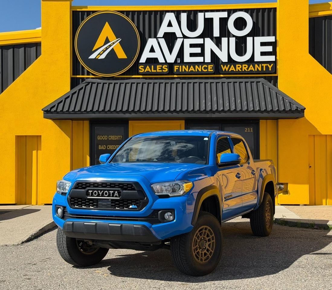 This outstanding example of a 2021 Toyota Tacoma is proudly offered by Auto Avenue Airdrie. <br/> Built for adventure and engineered for reliability, the Toyota Tacoma delivers legendary capability, rugged durability, and everyday practicality. Whether youre tackling challenging trails, hauling gear, or commuting through the city, this midsize pickup is designed to perform with confidence and ease. <br/> Equipped with a capable four-wheel drive system, this Tacoma provides exceptional traction, control, and stability in a wide range of road and off-road conditions. Inside, youll find a refined cabin featuring premium leather seating and an integrated navigation system, combining comfort, convenience, and advanced technology for every journey. <br/> Offering the perfect balance of toughness, versatility, and premium features, this 2021 Toyota Tacoma is ready for wherever the road&mdash;or trail&mdash;takes you. Dont miss your opportunity to own one of the most trusted and capable trucks on the market. <br/> AUTO AVENUE IS AN AMVIC LICENSED DEALERSHIP, COMMITTED TO PROVIDING EXCEPTIONAL SERVICE AND QUALITY VEHICLES WITH FLEXIBLE PAYMENT OPTIONS. <br/>