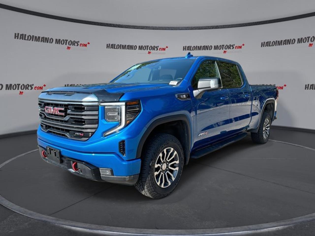 // ACCIDENT FREE!! //<br /><br />Built for drivers who want real capability and everyday comfort, this 2022 GMC Sierra 1500 AT4 Crew Cab 4WD is a confident full-size pickup with premium detail and diesel efficiency. Finished in blue with a black interior, this used GMC Sierra 1500 AT4 Crew Cab 4WD stands out with a bold look, four full doors, and a well-equipped cabin.<br /><br />With 92,500 km on the odometer, this accident-free truck is ready for work, travel, and weekend adventures. The 3.0-litre diesel engine pairs with an automatic transmission for smooth power delivery, while four-wheel drive adds extra control in changing Ontario weather. At Haldimand Motors Ltd. in Cayuga, this pickup offers strong value and proven versatility.<br /><br />FEATURES OF THE Sierra 1500 AT4 Crew Cab 4WD | No Accidents | Ventilated Seats | Leather Seats | Heated Steering<br /><br />   3.0-litre diesel power with strong torque<br />   Four-wheel drive for confident traction<br />   Ventilated front seats for added comfort<br />   Heated steering wheel for cold mornings<br /><br />TRUCK FEATURES<br /><br />   Trailer hitch ready for towing duties<br />   Trailer brake controller adds towing confidence<br />   Rear tow hook supports recovery situations<br />   Off-road tires enhance trail capability<br /><br />ADVANCED SAFETY FEATURES<br /><br />   Backup camera helps with reversing visibility<br />   Lane departure warning adds extra awareness<br />   Stability control supports secure handling<br />   Side impact airbags enhance occupant protection<br /><br />PERFORMANCE AND EFFICIENCY<br /><br />   3.0-litre diesel delivers strong pulling power<br />   Automatic transmission shifts smoothly and efficiently<br />   Four-wheel drive improves traction year-round<br />   Limited slip differential boosts grip<br /><br />COMFORT AND CONVENIENCE<br /><br />   Ventilated front seats add summer comfort<br />   Heated front and rear seats<br />   Dual-zone climate control keeps peace<br />   Remote starter adds everyday convenience<br /><br />TECHNONOLGY AND CONNECTIVITY<br /><br />   Apple CarPlay keeps apps within reach<br />   Android Auto supports easy smartphone access<br />   Navigation system helps guide every trip<br />   Bluetooth integration supports hands-free communication<br /><br />CARGO SPACE<br /><br />   Crew Cab adds useful interior storage<br />   Rear trunk access aids loading convenience<br />   Four full doors ease cabin entry<br />   Pickup bed supports versatile hauling tasks<br /><br />AWARDS & RECOGNITIONS<br /><br />   Best Buy Award, The Car Guide, 2022<br />   Best Full-Size Pickup, Auto123, 2022<br /><br />WHAT OTHER OWNERS LIKE<br /><br />   Strong diesel torque for daily driving<br />   Comfortable ride with premium cabin feel<br />   Useful towing features for truck owners<br />   Easy-to-use technology and infotainment system<br /><br />This GMC pickup blends rugged truck strength with thoughtful comfort features that make every drive more enjoyable. Ventilated front seats, heated front and rear seats, and a heated steering wheel help keep the cabin comfortable in every season. Memory seats, power-adjustable front seats, and lumbar support for both front occupants add welcome ease on longer trips.<br /><br />This 2022 GMC Sierra 1500 AT4 Crew Cab 4WD also brings smart convenience to daily use. Push-button start, power windows, heated and retractable mirrors, automatic door locks, cruise control, and an auto-dimming rearview mirror all help simplify your routine. Tinted windows, fog lights, LED headlamps, and a rear window defroster add practical value in changing road and weather conditions.<br /><br />Technology is another strong point in this truck. The cabin includes satellite radio, HD Radio, steering wheel audio controls, WiFi hotspot capability, and a navigation system for easy route planning. Apple CarPlay and Android Auto help keep your favourite apps close by, while Bluetooth integration supports calls and audio streaming without distraction.<br /><br />For drivers who need a truck that can handle towing, rougher roads, and family use without giving up comfort, this GMC is an excellent fit. The trailer hitch, trailer brake controller, off-road tires, and four-wheel-drive system support serious utility, while the roomy Crew Cab layout gives passengers space to relax.<br /><br />This 2022 GMC Sierra 1500 AT4 Crew Cab 4WD | No Accidents | Ventilated Seats | Leather Seats | Heated Steerings VIN is: 3GTUUEET3NG503966.<br /><br />WHY CHOOSE US? <br /><br />Honest & Transparent Buying Experience: Weve been a trusted name in business since 1984.<br /><br />STRAIGHTFORWARD PRICING:<br />Our Advertised Price Includes:<br />>>Safety Certification (No separate fee!)<br />>>30-Day 100% Mechanical Warranty<br />>>FREE Carfax History Report.<br />>>No upcharge for paying cash.<br />(Prices Exclude HST and Licensing Fees only.)<br /><br />>>Browse 300+ vehicles all in ONE LOCATION<br /><br />EASY FINANCING: Great rates & open loans<br /><br />WE BUY CARS: Get Top Dollar for your trade-in, or sell us your vehicle for CASH! Even if you dont buy from us!<br /><br />STOP BY TODAY<br />Treat yourself - stop by Haldimand Motors Ltd. located at 42 Talbot St E, Cayuga, ON N0A 1E0 to make this car yours today!<br /><br />https://www.haldimandmotors.com/used/stock-460974.html