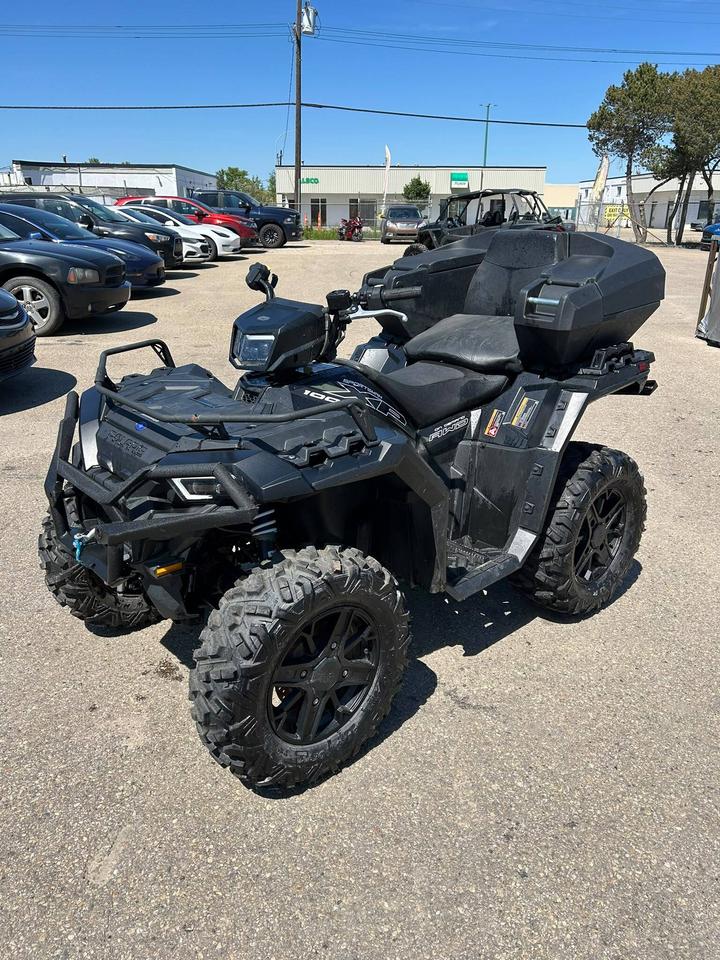 <p data-start=0 data-end=395>The 2023 Polaris Sportsman XP 1000 Ultimate Trail is built for riders who want premium performance, advanced technology, and serious capability in a high-performance ATV. Powered by a 952 cc ProStar&reg; twin-cylinder engine producing 90 horsepower, it delivers strong acceleration, impressive torque, and reliable power for hauling, towing, and tackling challenging terrain with confidence.</p><p data-start=0 data-end=395>&nbsp;</p><p data-start=397 data-end=786>Purpose-built for aggressive trail riding, the Sportsman XP 1000 Ultimate Trail features On-Demand AWD/2WD for instant traction when conditions change, along with engine braking and Active Descent Control for improved control on steep and technical terrain. Its multi-select Electronic Power Steering (EPS) provides smooth handling and helps reduce rider fatigue on long rides.</p><p data-start=397 data-end=786>&nbsp;</p><p data-start=788 data-end=1157>Equipped with 27-inch all-terrain tires on 14-inch aluminum wheels, high-clearance arched A-arms, and generous ground clearance, this ATV is built to handle mud, rocks, ruts, and rough trails with confidence. The Ultimate Trail package also includes premium features such as a 3,500 lb winch, heavy-duty front and rear bumpers, LED lighting, and a premium seat.</p><p data-start=788 data-end=1157>&nbsp;</p><p data-start=1159 data-end=1394>With strong towing capacity, durable front and rear cargo racks, and advanced factory features, the 2023 Polaris Sportsman XP 1000 Ultimate Trail is ready for demanding work during the week and serious trail riding on the weekends.</p><p data-start=1159 data-end=1394>&nbsp;</p><p data-start=1396 data-end=1604>Whether youre exploring backcountry trails, tackling tough terrain, or hauling gear, the 2023 Polaris Sportsman XP 1000 Ultimate Trail delivers premium performance, comfort, and capability in every ride.</p><p data-start=1396 data-end=1604>&nbsp;</p><p data-start=1606 data-end=1691 data-is-last-node= data-is-only-node=>Contact us today to learn more about financing, trade-ins, or delivery across Canada!</p>