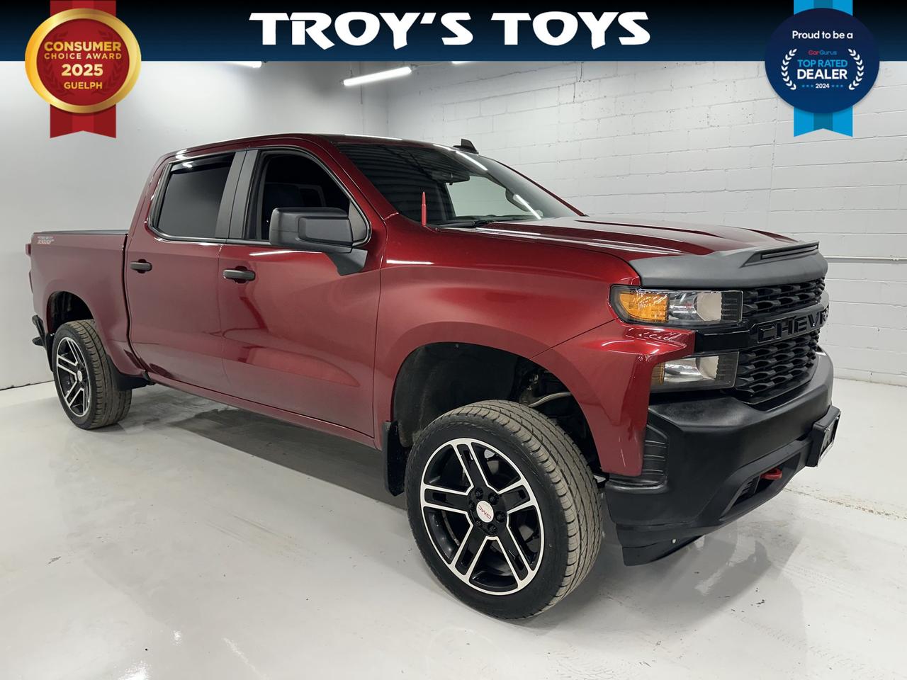 <p>Get ready to conquer any road and haul anything your adventures demand with this rugged 2019 Chevrolet Silverado 1500 Custom Trail Boss, now available at Troys Toys! Dressed in a striking red exterior that perfectly complements its aggressive stance, this truck is built for those who appreciate both power and presence. Step inside to a comfortable black interior, a clean canvas ready for whatever life throws your way. Under the hood, youll find the robust 5.3L V8 engine, paired with a smooth automatic transmission and dependable 4-wheel drive, ensuring you have the capability to tackle challenging terrain and heavy loads with confidence.</p><p>This isnt just a truck; its a statement. With 175,169 kilometers on the odometer, this Silverado 1500 Custom Trail Boss has proven its mettle and is eager for its next chapter of service. Its spacious four-door cab offers ample room for your crew and gear, making it ideal for work or play. Whether youre heading to the job site, venturing off-road, or embarking on a cross-country road trip, this Silverado is engineered to perform, offering a driving experience thats as commanding as it is comfortable.</p><p>Here are 5 features that make this Silverado 1500 Custom Trail Boss truly stand out:</p><ul><li><strong>Trail Boss Capability:</strong> This trim isnt just a name; it means youre equipped with off-road enhancements ready to take you where the pavement ends.</li><li><strong>Powerful 5.3L V8 Engine:</strong> Experience exhilarating acceleration and the muscle you need for towing and hauling.</li><li><strong>4-Wheel Drive System:</strong> Conquer any weather or terrain with unwavering traction and control.</li><li><strong>Rugged Red Exterior:</strong> Turn heads with a bold and classic colour that exudes confidence.</li><li><strong>Spacious 4-Door Cab:</strong> Plenty of room for passengers and all your essential gear, ensuring everyone is comfortable on every journey.</li></ul><p><strong><em>Powered by AutoIntelligence&trade;</em></strong></p><p>Vehicle information has been generated using artificial intelligence and is provided for informational purposes only. While efforts are made to ensure accuracy, please confirm all details directly with the dealer.</p>