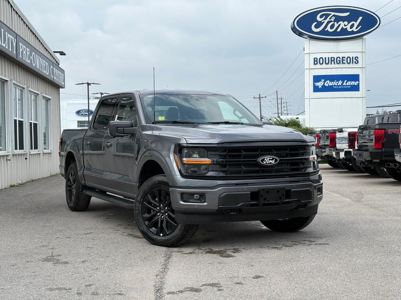 <p>Drive into the future with the 2026 Ford F-150 XLT in a stunning gray finish, equipped with advanced 4×4 capabilities. This formidable truck offers excellent handling, making it a reliable companion on and off the road.</p><p>The exterior boasts a sophisticated Carbonized Grey Metallic hue, accented by the XLT Black Appearance Package with its striking black grille, running boards, and glossy 20" aluminum wheels. Inside, the black interior is both stylish and functional, featuring dark appliques and comfortable cloth front seats with a convenient console.</p><p>Equipped with cutting-edge technology, the F-150 is ready for anything. The BED UTILITY PACKAGE offers practical features like LED Box Lighting and a work-surface tailgate. Tech-savvy drivers will appreciate smart device integration, a Wi-Fi hotspot, and the adaptability provided by selectable drive modes including sport and tow/haul.</p><p>Safety is a priority with features such as lane assist, a backup camera, parking sensors, and a driver's side SecuriCode keyless-entry keypad. The truck's brake assist and tow-ready capability are complemented by heated mirrors and cruise control, ensuring a confident drive every time.</p><p>This truck is perfect for adventurers and practical drivers who demand power and style. Contact Bourgeois Motors Ltd. to learn more about this impressive vehicle and make it yours today.</p> <p><span style=color:rgb( 58 , 80 , 95 )>The discount shown on vehicle represents the </span><u>Cash Purchase</u><span style=color:rgb( 58 , 80 , 95 )> discount and is inclusive of all non-stackable and stackable cash purchase discounts from Ford of Canada and Bourgeois Motors Ltd. and is offered in lieu of sub-vented lease or finance rates. To get details on current discounts applicable to this and other vehicles in our inventory for Lease and Finance customer, see a member of our team. All offers for lease or finance are On Approved Credit (OAC).While every effort is made to ensure the accuracy of discounts and programs, programs are subject to change without notice </span><span style=color:rgb( 119 , 119 , 119 )>and may not be accurate or completely current. While every reasonable effort is made to ensure the accuracy of this data, we are not responsible for any errors or omissions contained on these pages.</span></p> <p><strong>Why Choose the Bourgeois Auto Group?</strong></p><p>For 80 years, Bourgeois Auto Group has been delivering exceptional automotive experiences. Our factor trained teams work to ensure you receive the shopping experience you deserve; whether you're looking for a new or new-to-you vehicle.</p><p>Shop 24/7 with our online showroom and chat service, ensuring convenience every step of the way. No hidden fees, full disclosure, and every pre-owned vehicle comes with a Carfax® report for peace of mind.</p><p>We offer a wide selection of pre-owned vehicles, all competitively priced using real-time market data. Get the best deal on your purchase and trade-in with our free Live Market Analysis report.</p><p>Looking to sell your car? We buy any make or modelno purchase required. Our simple to use online trade valuation tool will provide you with a clear, transparent selling experience whether you buy our car or not.</p><p>Backed by hundreds dedicated employees across 4 convenient locations, were here to meet all your automotive needs. Visit us in Midland or Parry Sound and explore our inventory or schedule your next service today.</p> <p><strong>Financing Your Next Vehicle with Bourgeois Motors Ford in Midland:</strong></p><p>At Bourgeois Motors Ford, we make financing your next vehicle simple and stress-free! Our team works with trusted lenders to find flexible options tailored to your budget. Drive away with confidenceapply today!</p><p>Take advantage of our online pre-qualification tool, backed by Equifax and TD Bank to find the payment that works for you. Simply <a href=https://www.bourgeoismotors.com/free-credit-check/ rel=nofollow><strong>CLICK HERE</strong></a><strong> </strong>to use our secure online credit tool with no impact to your credit.</p>