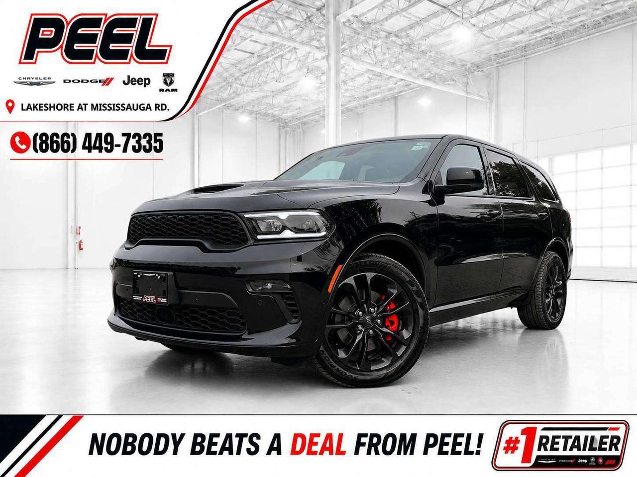 COME SEE WHY NOBODY BEATS A DEAL FROM PEEL! Your Source for ALL make and models used cars and trucks.

2022 Dodge Durango R/T Plus AWD | 5.7L HEMI V8 | DB Black | Heated & Ventilated Black/Red Nappa Leather Bucket Seats | Uconnect 5 NAV w/ 10.1" Touchscreen Display | 19-speaker Harman/Kardon High Performance Audio System | Blacktop Package | Power Sunroof | Dinamica Suede Headliner | Heated Steering Wheel | Remote Start | Wireless Apple CarPlay & Android Auto | Wireless Smartphone Charging Pad | Dodge Performance Pages | Adaptive Cruise Control w/ Stop & Go | Forward Collision Warning w/ Active Braking | Lane Departure Warning w/ Lane Keep Assist | Blind Spot Monitoring w/ Rear Cross-Path Detection | Park-sense Front & Rear Parking Sensors | ParkView Rear Back-up Camera | Power Liftgate | Second-row Fold & Tumble Captain&rsquo;s Chairs | Second-row Full Console | 6-passenger Seating | Trailer Tow Group IV | 2-speed On-demand Transfer Case | Class IV Hitch Receiver | Trailer Brake Control | 4 & 7-pin Wiring Harness | 20x8 Black Noise Aluminum Wheels

This 2022 Dodge Durango R/T Plus comes finished in DB Black and is powered by the legendary 5.7L HEMI V8, giving you the Mopar muscle, unmistakable V8 character, and confident AWD capability that make the Durango one of the most exciting three-row SUVs on the road. The R/T Plus adds an impressive level of luxury to that performance-focused foundation, with heated and ventilated black and red Nappa leather-faced bucket seats, a heated steering wheel, power sunroof, Dinamica suede headliner, and a 19-speaker Harman/Kardon High Performance Audio System. Inside the driver-focused cockpit, the Uconnect 5 10.1-inch touchscreen with navigation, wireless Apple CarPlay and Android Auto, wireless smartphone charging, and Dodge Performance Pages keep the technology as engaging as the HEMI under the hood. The Blacktop Package gives it the aggressive appearance buyers want with 20-inch Black Noise wheels, dark exterior accents, and Pirelli performance all-season tires, while second-row captain&rsquo;s chairs and a full centre console create a comfortable and practical six-passenger layout. It is also properly equipped for towing with Trailer Tow Group IV, including a Class IV hitch receiver, integrated trailer brake controller, 4- and 7-pin wiring, and a 2-speed on-demand transfer case. Finished with Adaptive Cruise Control, Forward Collision Warning, Lane Departure Warning with Lane Keep Assist, Blind Spot Monitoring, Park-sense Front & Rear Parking Sensors, a power liftgate, and remote start, this R/T Plus checks the right boxes for HEMI performance, premium comfort, bold Blacktop styling, family practicality, and real towing usefulness.
______________________________________________________

FREE CarFax included! Click the CarFax link in the listing to view the report.

Our advertised prices are for consumers/end users only and are not intended for dealer, wholesale, exporter, or broker purchases.
______________________________________________________

Peel Chrysler is based in Port Credit, Mississauga, and proudly serves customers across Ontario and Canada, including Toronto, Oakville, North York, Richmond Hill, Ajax, Hamilton, Niagara Falls, Brampton, Scarborough, Vaughan, London, Windsor, Cambridge, Kitchener, Waterloo, Brantford, Sarnia, Pickering, Huntsville, Milton, Woodbridge, Aurora, Newmarket, Orangeville, Georgetown, Markham, North Bay, Sudbury, Barrie, Oshawa, Kingston, Innisfil, and surrounding areas. Browse our selection of used cars, trucks, SUVs, vans, Ram, Jeep, Dodge, Chrysler, FIAT, and all makes and models at peelchrysler.com.
______________________________________________________

Disclaimer: Prices are for consumer/end-user purchases only. Advertised prices are all-in and include all dealer fees and charges, including the $499 loan processing fee where applicable, except HST, Fuel and Licensing, unless otherwise stated. Payments, rates, and terms are subject to approved credit and may change without notice. If a trade-in has an outstanding loan balance and Peel Chrysler is required to facilitate the lien payout, a $349 lien payout fee applies. Most pre-owned vehicles originally come with two keys; however, all Peel Chrysler pre-owned vehicles come standard with one key unless otherwise stated. Vehicle images may be digitally adjusted or enhanced for presentation purposes and may not always reflect the exact appearance of the vehicle. While we make every effort to ensure accuracy, vehicle details, features, options, materials, history, specifications, pricing, availability, and CarFax information should be verified with Peel Chrysler before purchase.