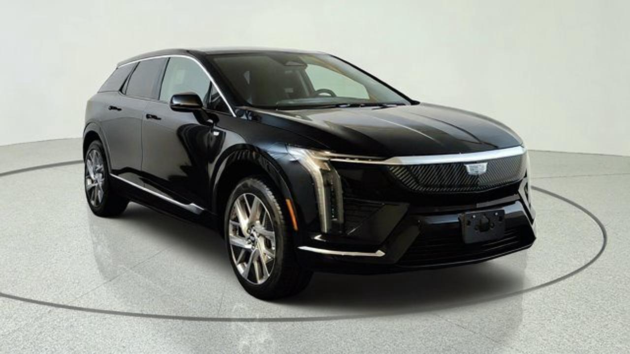 The 2027 Cadillac OPTIQ Sport delivers a refined all-electric luxury SUV experience with bold styling, responsive dual-motor all-wheel drive, and impressive everyday versatility. Its range of 482 km on a full charge will impress. Its sleek exterior is complemented by a premium cabin featuring advanced technology, including a large curved LED display with Google built-in, wireless Apple CarPlay and Android Auto compatibility, and a premium audio system for an immersive driving experience. Designed with comfort in mind, the OPTIQ Sport offers spacious seating, high-quality materials, and a generous cargo area, making it ideal for both daily commutes and weekend getaways. Advanced driver assistance features, including Cadillacs latest safety technologies and available Super Cruise hands-free driving capability, help provide confidence and convenience on the road. Combining luxury, innovative EV performance, and cutting-edge technology, the 2027 Cadillac OPTIQ Sport is an outstanding choice for drivers seeking a premium electric SUV.