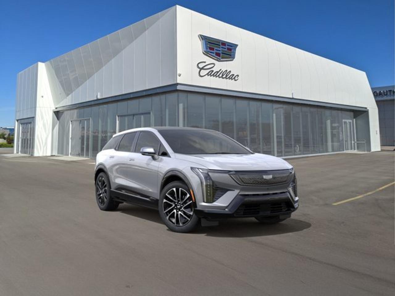 The 2027 Cadillac OPTIQ Sport delivers a refined all-electric luxury SUV experience with bold styling, responsive dual-motor all-wheel drive, and impressive everyday versatility. Its range of 482 km on a full charge will impress. Its sleek exterior is complemented by a premium cabin featuring advanced technology, including a large curved LED display with Google built-in, wireless Apple CarPlay and Android Auto compatibility, and a premium audio system for an immersive driving experience. Designed with comfort in mind, the OPTIQ Sport offers spacious seating, high-quality materials, and a generous cargo area, making it ideal for both daily commutes and weekend getaways. Advanced driver assistance features, including Cadillacs latest safety technologies and available Super Cruise hands-free driving capability, help provide confidence and convenience on the road. Combining luxury, innovative EV performance, and cutting-edge technology, the 2027 Cadillac OPTIQ Sport is an outstanding choice for drivers seeking a premium electric SUV.
