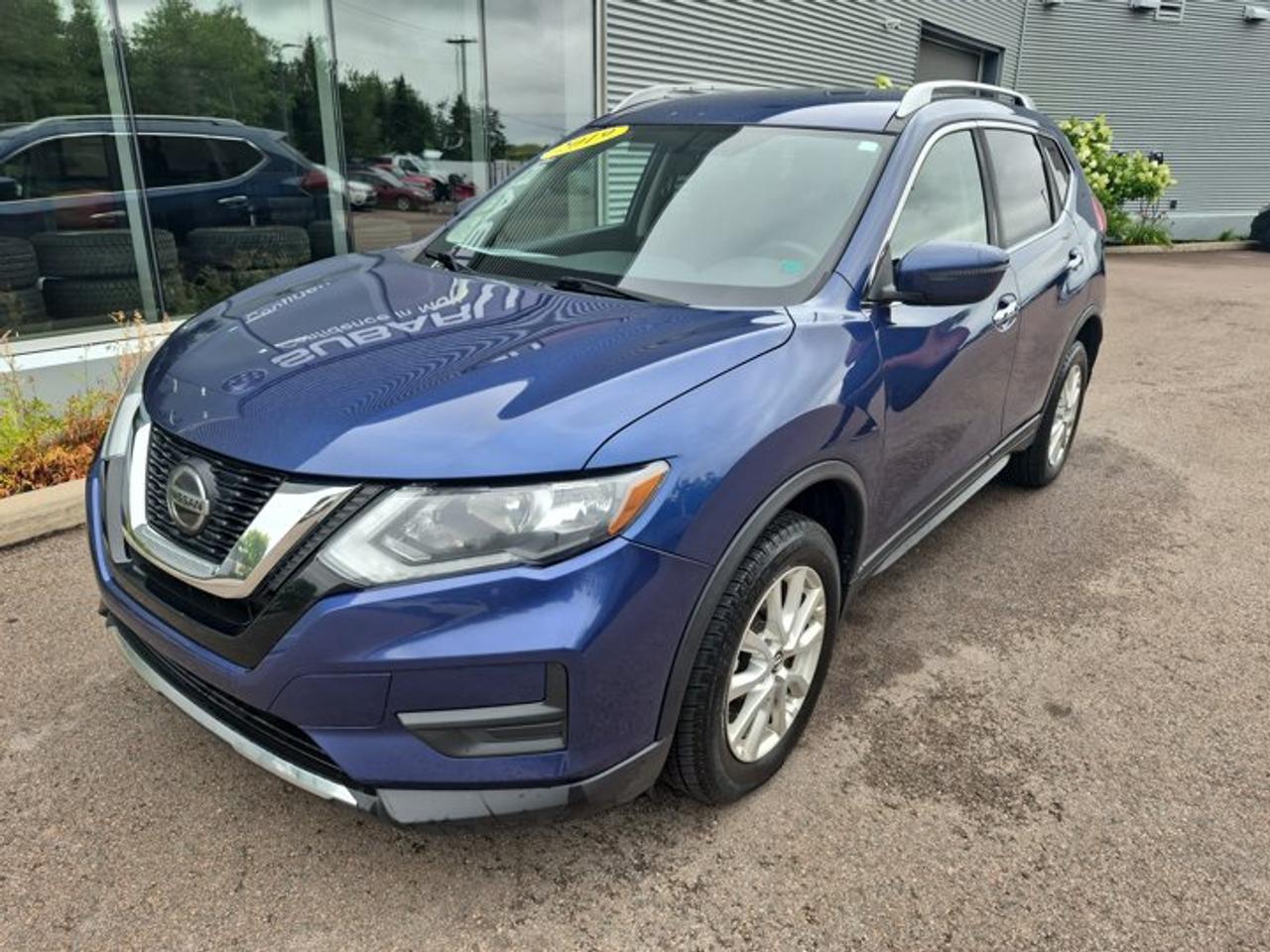 **2019 Nissan Rogue S AWD | Fuel Efficient | Spacious Interior | Family-Friendly SUV**Discover comfort, versatility, and confidence with this **2019 Nissan Rogue S**. Designed for everyday practicality, the Rogue offers a spacious cabin, impressive cargo flexibility, and advanced features to make every drive more enjoyable.Powered by a fuel-efficient 2.5L 4-cylinder engine paired with a smooth Xtronic CVT® automatic transmission, the Rogue delivers a comfortable and efficient driving experience. Available Intelligent All-Wheel Drive provides added confidence and traction when road conditions change.Inside, youll find a well-designed interior featuring comfortable seating, a touchscreen infotainment system with Apple CarPlay®, Android Auto , Bluetooth® connectivity, and a rearview camera. With flexible rear seating and generous cargo space, the Rogue is ready for commuting, errands, and family adventures.Nissan Intelligent Mobility safety technologies provide added peace of mind with features designed to help keep you aware and confident behind the wheel.**Key Features:*** 2.5L 4-cylinder engine* Xtronic CVT® automatic transmission* Available Intelligent All-Wheel Drive* NissanConnect® touchscreen infotainment system* Apple CarPlay® & Android Auto* Bluetooth® hands-free calling and audio streaming* Rearview camera* Cruise control* Steering wheel-mounted audio controls* Air conditioning* Remote keyless entry* Power windows, locks, and mirrors* Split-folding rear seats* Rear cargo area storage* Alloy wheels* Hill Start AssistOffering excellent versatility, fuel efficiency, and everyday comfort, this **2019 Nissan Rogue S** is a smart choice for drivers looking for a dependable and practical compact SUV. Contact us today to schedule your test drive!