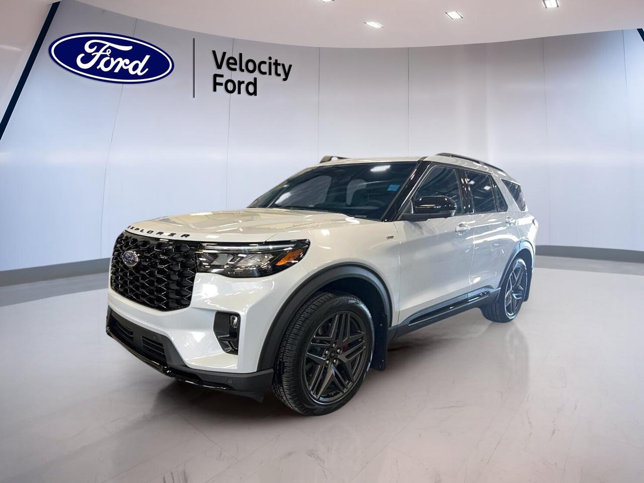 Discover the brand new 2026 Ford Explorer ST-Line 4WD at Velocity Ford in Moose Jaw. This midsize SUV blends sporty style, confident four-wheel drive traction, and family-ready space in one smart package. Finished in White with a Black interior, it delivers a clean, modern look for daily driving and weekend travel.

This 2026 Ford Explorer ST-Line 4WD features a 2.3-litre unleaded engine paired with an automatic transmission for smooth, easy performance. With four doors, flexible passenger room, and a practical SUV layout, it is built to handle changing Prairie weather while keeping comfort and control front and centre.

FEATURES OF THE Explorer ST-Line 4WD

»» Sporty ST-Line exterior trim details
»» Four-wheel drive for all-season confidence
»» 2.3-litre engine with automatic transmission
»» White exterior with Black interior

ADVANCED SAFETY FEATURES

»» Anti-lock braking system helps maintain control
»» Stability control supports secure road handling
»» Backup camera assists with reversing visibility
»» Blind spot monitor adds lane awareness

PERFORMANCE AND EFFICIENCY

»» 2.3-litre unleaded engine balances responsive power
»» Automatic transmission delivers smooth shifting
»» Four-wheel drive improves traction year-round
»» Cruise control supports relaxed highway travel

COMFORT AND CONVENIENCE

»» Dual-zone climate control improves cabin comfort
»» Heated front seats help cold mornings
»» Power liftgate adds everyday loading ease
»» Remote starter helps pre-condition the cabin

TECHNOLOGY AND CONNECTIVITY

»» Navigation system provides clear route guidance
»» Bluetooth integration supports hands-free calling
»» WiFi hotspot keeps devices connected
»» Steering wheel audio controls simplify use

CARGO SPACE

»» Power liftgate helps with cargo access
»» Four-door layout supports easy loading
»» Rear area suits daily gear
»» SUV design offers flexible utility

WHAT OTHER OWNERS LIKE

»» Confident all-weather traction from four-wheel drive
»» Comfortable ride for family travel
»» Easy-to-use infotainment and connectivity features
»» Useful cargo room for everyday needs

The 2026 Ford Explorer ST-Line 4WD also includes heated mirrors, power mirrors, power windows, front air conditioning, automatic headlights, rear spoiler, tinted windows, satellite radio, HD Radio, leather-wrapped steering wheel, push-button start, fog lights, tire pressure monitoring, lane departure warning, rear climate control, rear air conditioning, rear window defroster, child safety locks, driver and passenger airbags, side impact airbags, head side airbags, passenger airbag sensor, automatic door locks, drivers seat lumbar support, passenger lumbar support, ambient lighting, and both driver and passenger power seat adjustment.

This brand new 2026 Ford Explorer ST-Line 4WD is a strong fit for drivers who want modern safety, smart technology, practical comfort, and capable four-wheel drive in one well-equipped SUV. Visit Velocity Ford in Moose Jaw to see how this new Explorer brings style, utility, and confidence to every drive.

This 2026 Ford Explorer ST-Line 4WDs VIN is: 1FMUK8KH5TGC10422 .