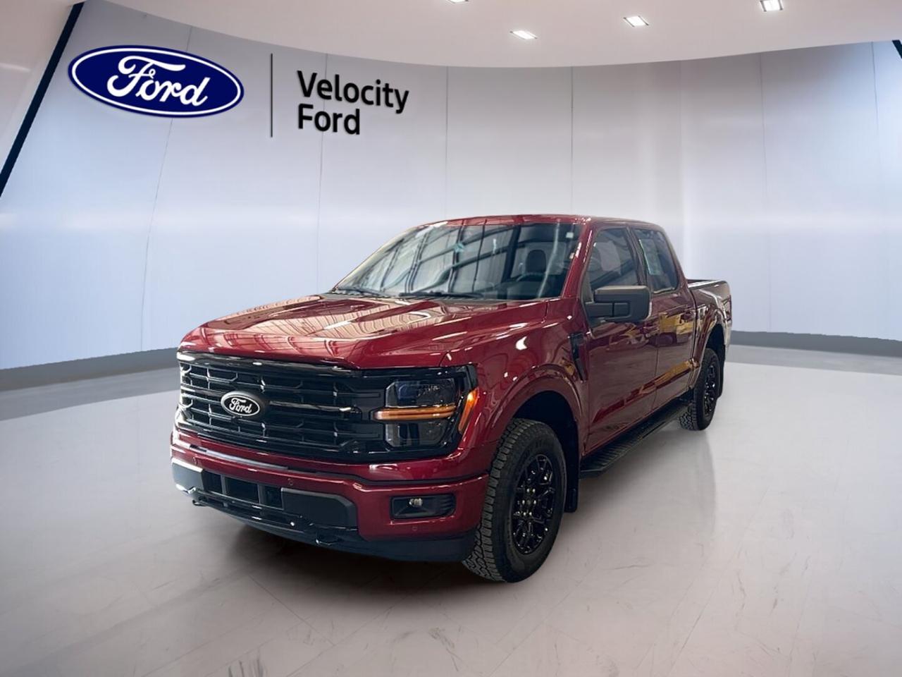 Built to handle work, weather, and daily life in Saskatchewan, the 2026 Ford F-150 XLT 4WD SuperCrew 5.5 Box is a brand new full-size truck with the right mix of strength, comfort, and modern safety. Finished in red with a black interior, this four-door pickup brings practical capability and confident road presence to Moose Jaw drivers.

With its 3.5-litre unleaded engine, automatic transmission, and four-wheel drive system, the 2026 Ford F-150 XLT 4WD SuperCrew 5.5 Box is ready for changing road conditions and demanding tasks. It also adds useful everyday features like cruise control, heated mirrors, a backup camera, Bluetooth integration, and lane departure warning for a well-rounded driving experience.

FEATURES OF THE F-150 XLT 4WD SuperCrew 5.5 Box
»» SuperCrew cab adds roomy rear seating
»» 5.5-foot box supports daily hauling needs
»» Four-wheel drive helps in rough conditions
»» XLT trim balances value and utility

TRUCK FEATURES
»» Tows up to 4,671 kg confidently
»» Rear tow hook supports jobsite recovery
»» Off-road tires add extra traction
»» Spare tire helps during roadside issues

ADVANCED SAFETY FEATURES
»» Backup camera helps with reverse visibility
»» Blind spot monitor adds lane awareness
»» Lane departure warning supports safer travel
»» Side and head airbags enhance protection

PERFORMANCE AND EFFICIENCY
»» 3.5-litre unleaded engine delivers solid power
»» Automatic transmission shifts smoothly every day
»» Dual shift mode adds driver control
»» Four-wheel drive boosts all-season traction

COMFORT AND CONVENIENCE
»» Cruise control supports relaxed highway driving
»» Front air conditioning keeps cabin comfortable
»» Power windows add everyday ease
»» Driver lumbar support improves comfort

TECHNOLOGY AND CONNECTIVITY
»» Bluetooth integration supports hands-free calling
»» WiFi hotspot keeps passengers connected
»» Satellite radio expands entertainment choices
»» Steering wheel audio controls add convenience

CARGO SPACE
»» 5.5-foot box handles gear with ease
»» Rear trunk access aids cargo loading
»» Four-door cab supports passenger flexibility
»» Tinted windows help protect cabin items

WHAT OTHER OWNERS LIKE
»» Strong towing ability for work needs
»» Spacious cabin for family and crew
»» Easy-to-use tech for daily driving
»» Confident four-wheel drive in winter

The 2026 Ford F-150 XLT 4WD SuperCrew 5.5 Box is a smart choice for drivers who want proven truck capability without giving up comfort or useful technology. From towing and hauling to commuting across Moose Jaw and beyond, this brand new pickup is equipped to do more while keeping daily operation simple and dependable.

Velocity Ford is proud to offer this new truck to shoppers looking for a capable full-size pickup with practical features and trusted Ford engineering. Its red exterior gives it a bold look, while the black interior keeps the cabin clean and functional. If you need a truck that is ready for work and ready for the road, this F-150 deserves a close look.

This 2026 Ford F-150 XLT 4WD SuperCrew 5.5 Boxs VIN is: 1FTFW3L87TKE48739.