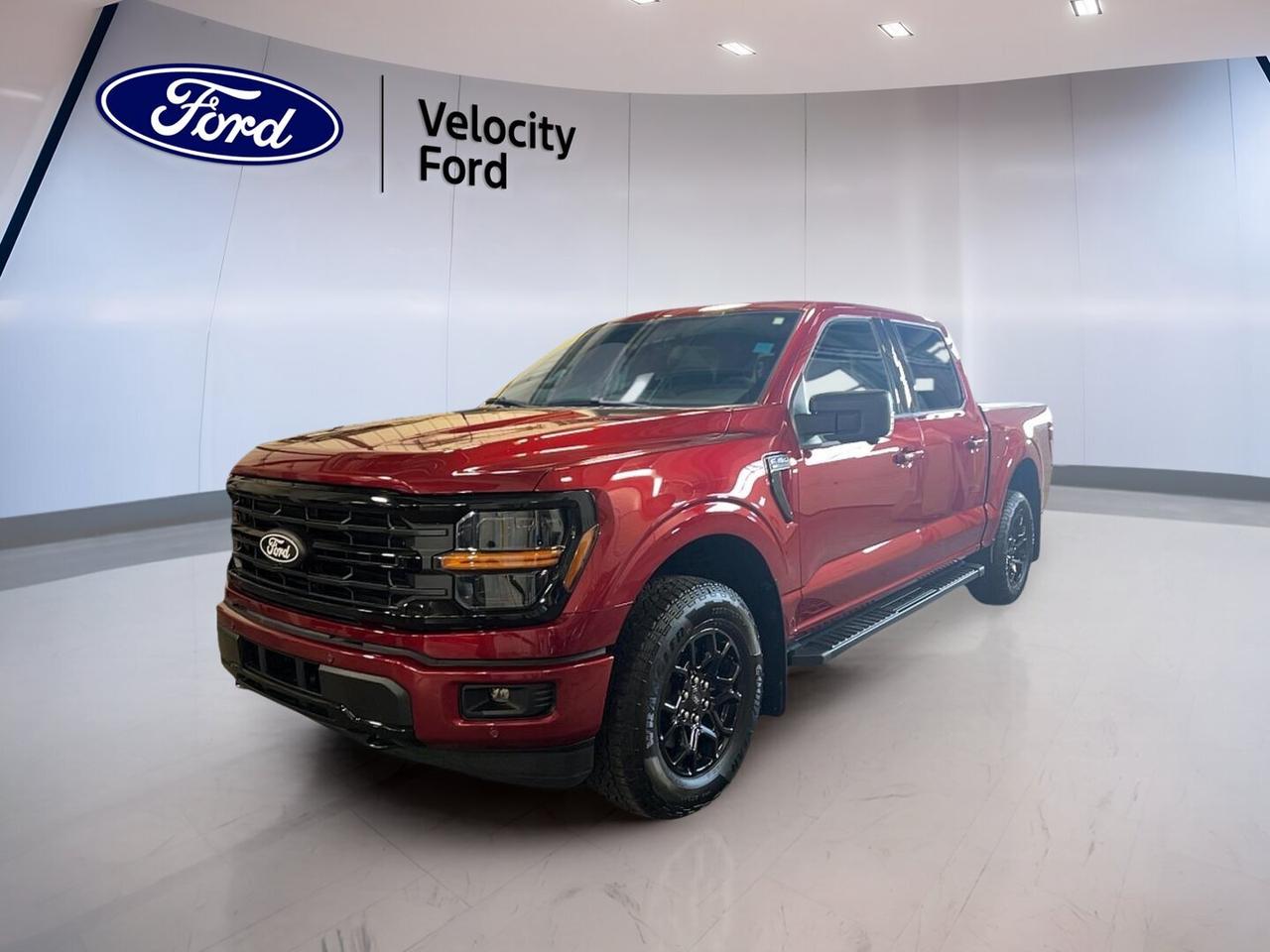 Meet the brand new 2026 Ford F-150 XLT 4WD SuperCrew 5.5 Box at Velocity Ford in Moose Jaw. This full-size truck blends proven capability, smart safety, and everyday comfort in one hard-working package. Finished in red with a black interior, it brings four full doors, automatic transmission, and a 3.5-litre unleaded engine for confident driving.

Built for busy workdays and active weekends, the 2026 Ford F-150 XLT 4WD SuperCrew 5.5 Box gives you strong towing ability up to 4,671 kg, practical cabin space, and useful tech that fits real life. Its short box design helps with easy parking, while four-wheel drive adds sure-footed traction when roads get rough.

FEATURES OF THE F-150 XLT 4WD SuperCrew 5.5 Box

»» Red exterior with bold truck presence
»» Black interior with roomy four-door cabin
»» Automatic transmission with dual shift mode
»» 3.5-litre unleaded engine and 4WD

TRUCK FEATURES

»» Tows up to 4,671 kg confidently
»» Rear tow hook adds extra utility
»» Off-road tires support rougher terrain
»» SuperCrew cab adds passenger room

ADVANCED SAFETY FEATURES

»» Backup camera helps with reversing views
»» Blind spot monitor boosts lane awareness
»» Lane departure warning adds confidence
»» Side and head airbags enhance protection

PERFORMANCE AND EFFICIENCY

»» 3.5-litre engine delivers strong everyday power
»» Automatic transmission supports smooth operation
»» Four-wheel drive improves traction in weather
»» Stability control helps keep handling composed

COMFORT AND CONVENIENCE

»» Cruise control supports relaxed highway travel
»» Front air conditioning keeps cabin comfortable
»» Power windows add daily driving ease
»» Driver lumbar support helps reduce fatigue

TECHNOLOGY AND CONNECTIVITY

»» Bluetooth integration supports hands-free calling
»» Wi-Fi hotspot keeps devices connected
»» Satellite radio expands entertainment choices
»» Steering wheel audio controls add convenience

CARGO SPACE

»» 5.5-foot box suits daily hauling needs
»» Rear trunk access aids loading tasks
»» Spare tire adds practical peace of mind
»» SuperCrew cabin offers extra interior storage

WHAT OTHER OWNERS LIKE

»» Strong towing ability for work and play
»» Spacious cab for family and crew
»» User-friendly tech for everyday driving
»» Confident four-wheel drive in changing conditions

This brand new 2026 Ford F-150 XLT 4WD SuperCrew 5.5 Box is a smart choice for drivers who want a truck that works hard without giving up comfort. Heated mirrors, power steering, anti-lock braking system, automatic headlights, fog lights, tinted windows, and tire pressure monitoring all add useful value to your day.

Inside, this truck is set up for simple, easy use. You get cloth seating, illuminated driver and passenger vanity mirrors, electric mirrors, rear window defroster, child safety locks, passenger airbag sensor, and automatic door locks. These are the features many drivers want most in a modern pickup.

If you need a new truck that can tow, handle Canadian weather, and keep you connected on the road, this 2026 Ford F-150 XLT 4WD SuperCrew 5.5 Box deserves a close look. Visit Velocity Ford in Moose Jaw and see how this capable new pickup fits your work, family, and weekend plans.

This 2026 Ford F-150 XLT 4WD SuperCrew 5.5 Boxs VIN is: 1FTFW3L88TKE45185.