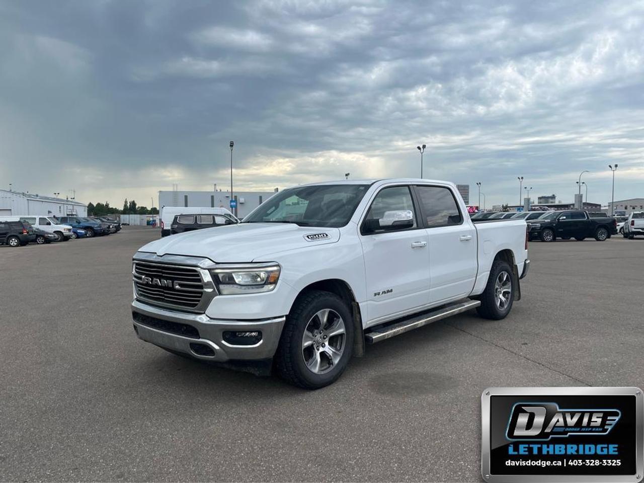 <p>Introducing the 2023 Ram 1500 Laramie 4x4 Crew Cab 5'7" Box, an exceptional truck that combines rugged power with sophisticated style. This stunning vehicle boasts a 4x4 drivetrain, ensuring impressive handling on any terrain. Its sleek black interior complements its robust exterior design, making it perfect for both work and play.</p> <ul><li><strong>Interior Features:</strong> <ul><li>Luxurious black leather seats offering heated and cooled front seating for maximum comfort</li><li>Heated leather steering wheel for added warmth during chilly days</li><li>Convenient remote start capability for those extra cold mornings</li><li>Smart device integration with a Wi-Fi hotspot for seamless connectivity</li></ul></li><li><strong>Exterior Features:</strong> <ul><li>Alloy wheels paired with an 18" aluminum spare wheel for impeccable style and reliability</li><li>Dual rear exhaust with bright tips presenting a bold statement</li><li>HEMI Badge illustrating the powerful 5.7L HEMI VVT V8 engine with eTorque</li></ul></li><li><strong>Technology & Safety Features:</strong> <ul><li>Blind Spot Monitoring for enhanced on-road awareness and safety</li><li>Backup camera making reversing hassle-free and safe</li><li>Advanced 19 speaker sound system delivering brilliant audio quality</li><li>Brake assist technology ensuring top-notch stopping power</li></ul></li></ul> <p>This Ram 1500 Laramie is perfectly suited for those who require a versatile vehicle with the capability to take on adventure after adventure. For more details or to book a test drive, contact Davis Dodge Lethbridge today.</p>