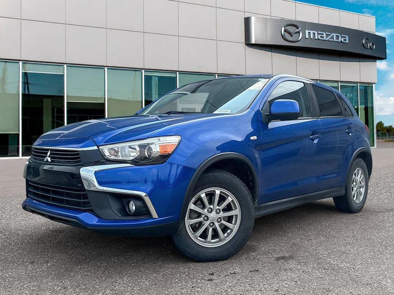 Experience reliability and style with this pre-owned 2017 Mitsubishi RVR SE AWD in striking Blue with a sleek Black interior. Powered by a fuel-efficient 2.0L I4 MIVEC engine paired with a smooth CVT, this compact SUV offers confident all-wheel-drive for year-round versatility. Enjoy comfort with heated front bucket seats and premium fabric trim, while advanced features like automatic climate control, a 6.1-inch touchscreen, and Bluetooth wireless audio streaming keep you connected and comfortable. Safety is prioritized with 7 airbags, stability control, hill start assist, and a rearview camera. With 16 alloy wheels and modern exterior accents, the RVR SE blends practicality with sporty style. Ideal for city drives and weekend getawaysstop by Go Mazda today to test drive this dependable, well-equipped Mitsubishi RVR!Go Mazda is an AMVIC licensed business.This vehicle show a CarFax incident of $8,600.91