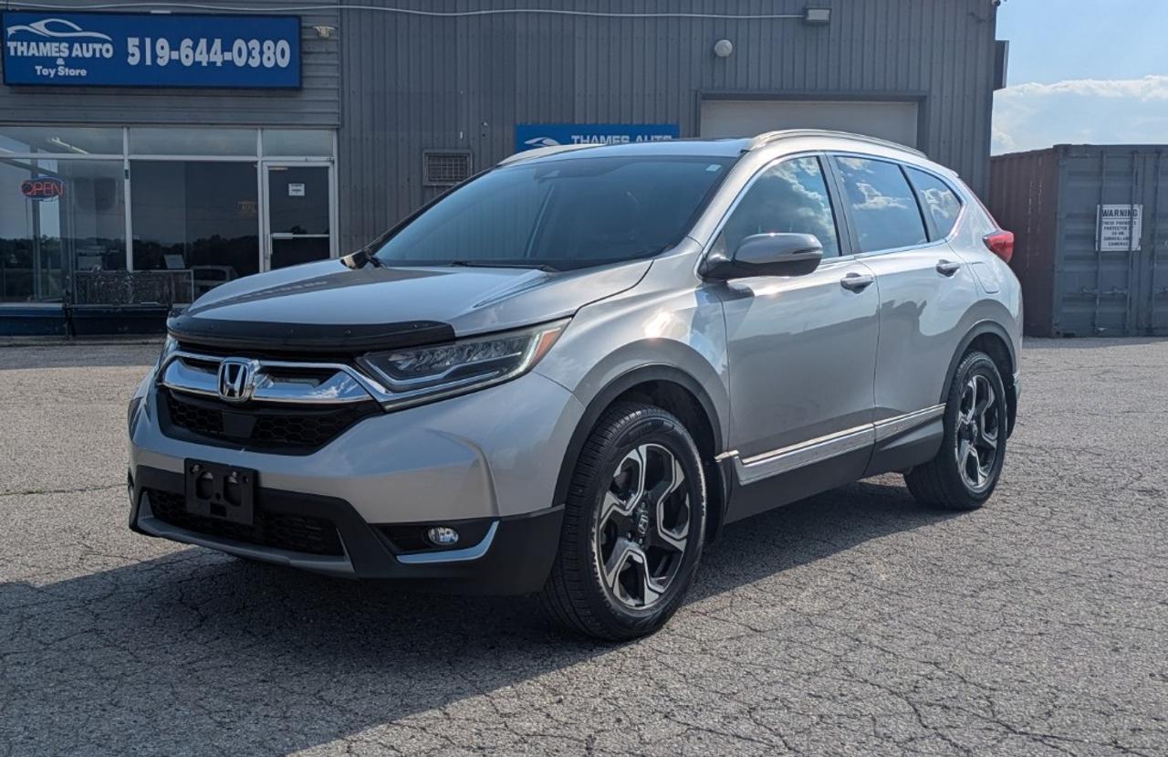 <p class=MsoNormal><strong><span style=font-size: 14.0pt; line-height: 107%; font-family: Aptos,sans-serif;>Only 143,400 kms. This extra clean, 2017 Honda CR-V Touring AWD, is</span></strong><span style=font-size: 14.0pt; line-height: 107%; font-family: Aptos,sans-serif;> the premium, top-of-the-line trim. It comes loaded with options and Honda&rsquo;s trusted&nbsp;<a href=https://www.honda.ca/content/honda.ca/e71abf3f-8a3d-472a-9fa4-55e1e6ed87ba/modelpage_downloads/hon18102_07_2017_cr-v_brochure_en_v10_online.pdf target=_blank rel=noopener>Real Time All-Wheel Drive system</a> for all-weather traction. 1.5L Turbocharged, 4-cylinder engine for incredible fuel economy and adequate power.</span></p><p class=MsoNormal><strong><span style=font-size: 14.0pt; line-height: 107%; font-family: Aptos,sans-serif;>All Leather Seating</span></strong><span style=font-size: 14.0pt; line-height: 107%; font-family: Aptos,sans-serif;>: Heated, power-adjustable front seats. Power glass moonroof. Navigation, Apple CarPlay, and Android Auto. Hands-free power tailgate. Automatic LED headlights. Adaptive Cruise Control, Lane Keeping Assist, and Blind Spot Monitoring and many more convenient features.</span></p><p class=MsoNormal><span style=font-size: 14.0pt; line-height: 107%; font-family: Aptos,sans-serif;>Dont wait to test drive this highly sought-after, premium compact SUV.</span></p><p class=MsoNormal><span style=font-size: 14.0pt; line-height: 107%; font-family: Aptos,sans-serif;>Clean CARFAX Report. No accidents or damage claims recorded. Fresh oil change, Fully Serviced, Safety Inspected & Certified.</span></p><p class=MsoNormal><span style=font-size: 14.0pt; line-height: 107%; font-family: Aptos,sans-serif;>Asking $20,995 + 13% HST and Vehicle Registration/Licencing requirements.</span></p>