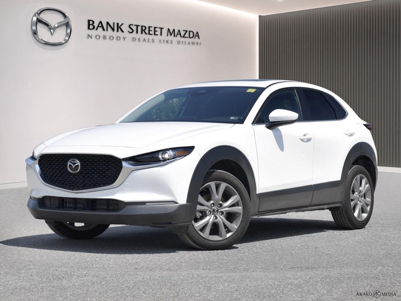 Experience the future of driving with the 2025 Mazda CX-30 GS in an elegant color that complements its all-wheel-drive capability. This SUV is designed for those who seek the perfect blend of power and refined handling. The exterior boasts sophisticated alloy wheels that add a touch of class, while the beautifully crafted design captures attention at every turn. Step inside to discover an inviting interior featuring heated front seats, a leather steering wheel, and leatherette door trim inserts, all providing a sense of luxury and comfort. Stay connected and drive with confidence with integrated smart technology like Bluetooth connectivity, a backup camera, and a user-friendly interface for smart device integration. Safety is paramount with advanced driver assistance including lane assist and adaptive cruise control, giving you peace of mind on every journey. Ideal for adventure seekers and commuters alike, this SUV offers the practicality and features you desire. Discover more about the 2025 Mazda CX-30 GS AWD at Bank Street Mazda. Contact us now to take a closer look and schedule your test drive!