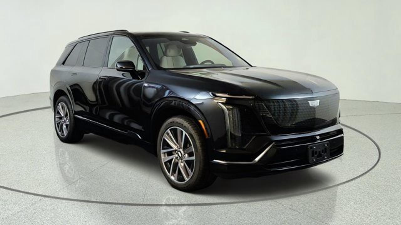 The 2027 Cadillac VISTIQ Sport is a three-row all-electric luxury SUV that combines striking design, exhilarating performance, and exceptional versatility for modern families. Its bold exterior styling is matched by a sophisticated interior featuring premium materials, spacious seating for up to seven passengers, and a panoramic glass roof that enhances the cabins open feel. Advanced technology includes a large curved LED display with Google built-in, wireless Apple CarPlay and Android Auto compatibility, a premium audio system, and available Super Cruise hands-free driving for added convenience on compatible highways. The dual-motor setup provides a range of 483 km, while its all-wheel drive delivers confident traction and responsive acceleration. The advanced Ultium battery platform provides impressive driving range and smooth electric performance. Blending luxury, cutting-edge innovation, and everyday practicality, the 2027 Cadillac VISTIQ Sport is an exceptional choice for drivers seeking a premium three-row electric SUV.