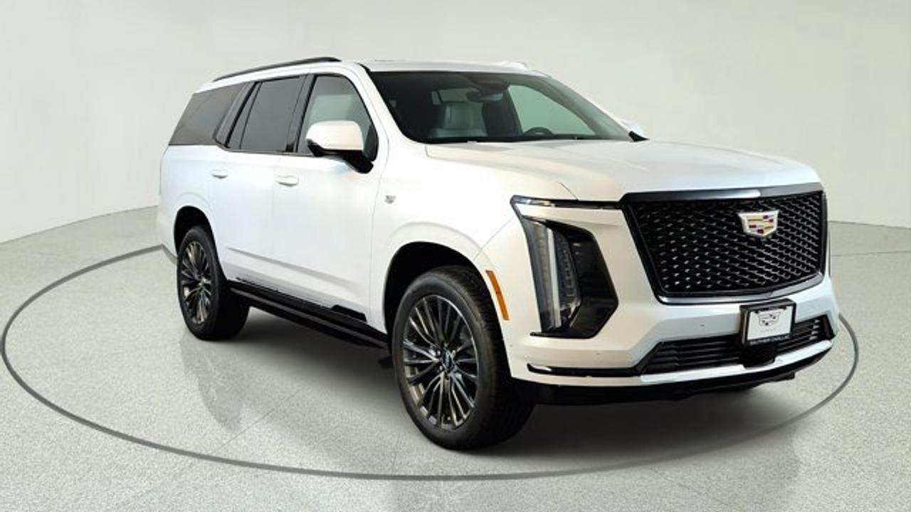 The 2026 Cadillac Escalade delivers iconic luxury, commanding performance, and advanced technology, making it one of the most desirable full-size luxury SUVs on the road. Powered by a robust 6.2L V8 engine paired with a smooth 10-speed automatic transmission, the Escalade offers confident towing capability and a refined driving experience. Inside, the spacious cabin features premium leather seating across all 3 rows, a stunning 55-inch pillar-to-pillar curved LED display, wireless Apple CarPlay and Android Auto, Google built-in compatibility, and a 38-speaker AKG Studio Reference audio for an immersive entertainment experience. Additional amenities include a panoramic power sunroof, a rear-seat entertainment system, front and rear soft-close doors and 16-way power-adjustable front seats with massage functionality. Advanced safety technologies, including Super Cruise hands-free driver assistance, Blind Zone Steering Assist, Forward Collision Alert, and Enhanced Automatic Emergency Braking, help provide added confidence on every journey. With its bold exterior styling, generous passenger and cargo space, and class-leading blend of luxury, innovation, and capability, the 2026 Cadillac Escalade sets the benchmark for premium SUVs.