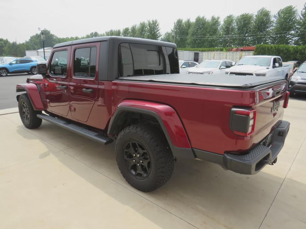 2021 Jeep Gladiator Sport | 4x4 | Automatic | Alloy Wheels | Removable Soft Top | Tow Hooks | Skid Plates | Air Conditioning | Cruise Control | Touchscreen Display | Android Auto & Apple CarPlay | USB-C Ports | Back-Up Camera | Steering Wheel Audio Controls | Heated Power Mi Photo
