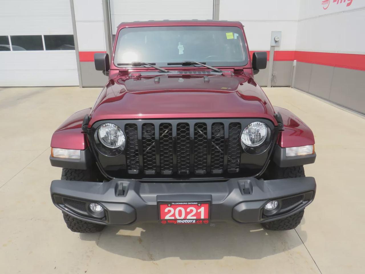 2021 Jeep Gladiator Sport | 4x4 | Automatic | Alloy Wheels | Removable Soft Top | Tow Hooks | Skid Plates | Air Conditioning | Cruise Control | Touchscreen Display | Android Auto & Apple CarPlay | USB-C Ports | Back-Up Camera | Steering Wheel Audio Controls | Heated Power Mi Photo