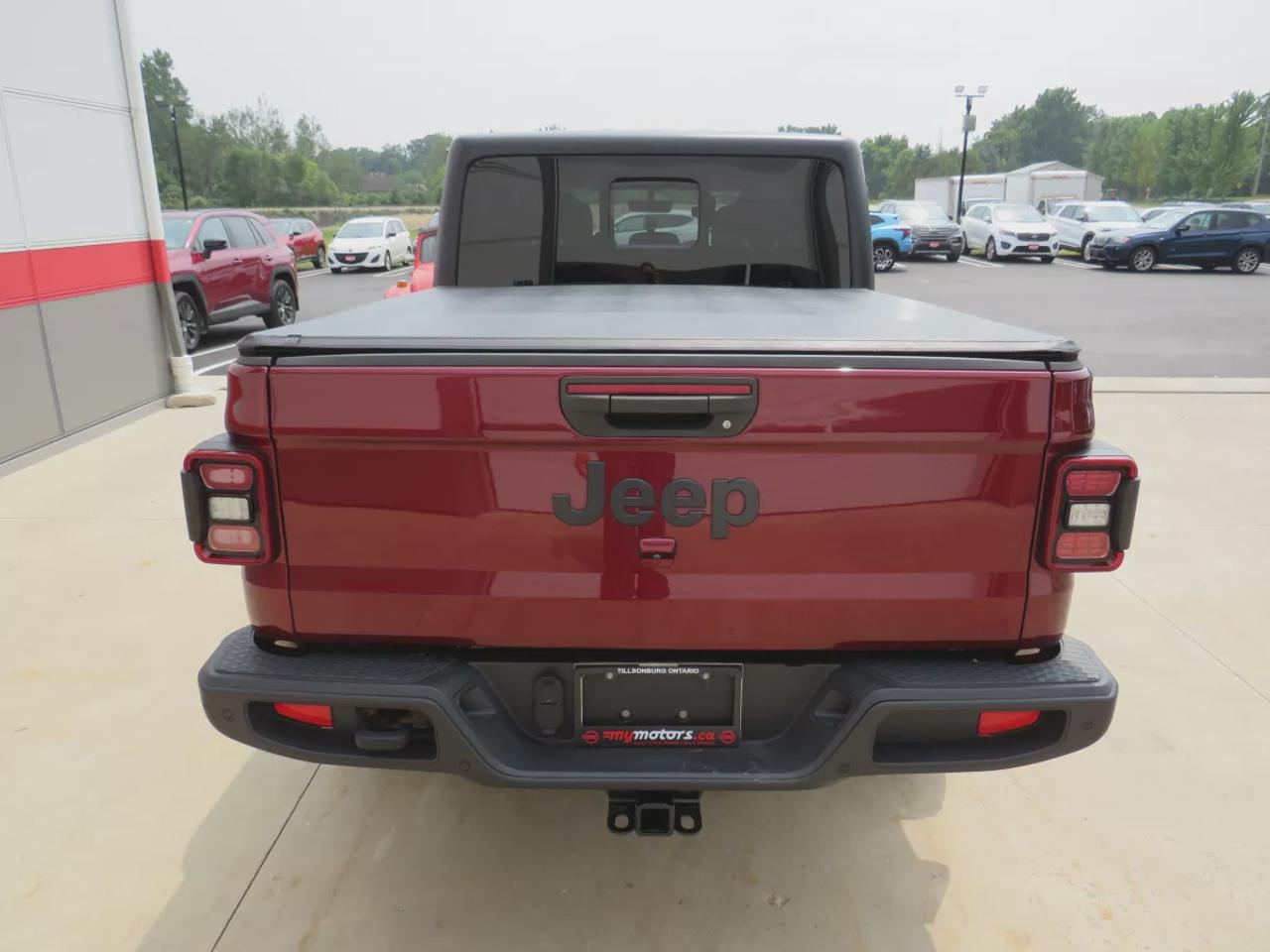 2021 Jeep Gladiator Sport | 4x4 | Automatic | Alloy Wheels | Removable Soft Top | Tow Hooks | Skid Plates | Air Conditioning | Cruise Control | Touchscreen Display | Android Auto & Apple CarPlay | USB-C Ports | Back-Up Camera | Steering Wheel Audio Controls | Heated Power Mi Photo
