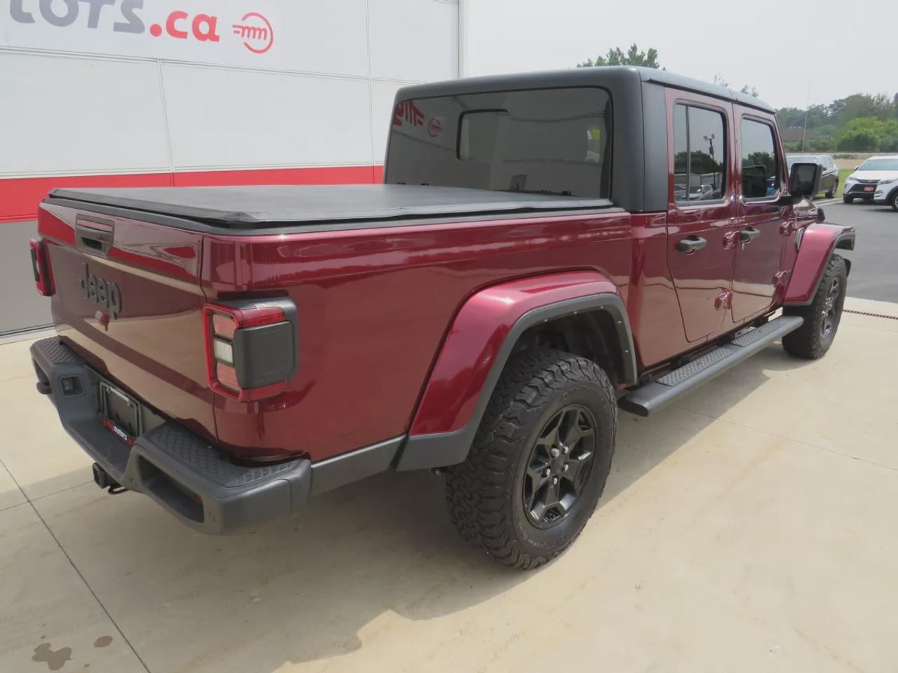 2021 Jeep Gladiator Sport | 4x4 | Automatic | Alloy Wheels | Removable Soft Top | Tow Hooks | Skid Plates | Air Conditioning | Cruise Control | Touchscreen Display | Android Auto & Apple CarPlay | USB-C Ports | Back-Up Camera | Steering Wheel Audio Controls | Heated Power Mi Photo