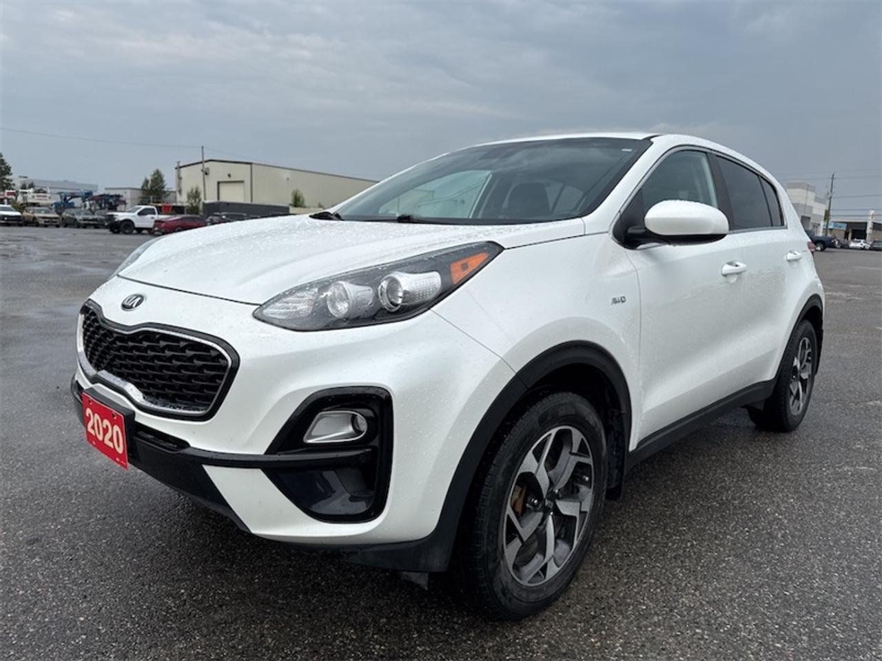 <b>Brand New Brakes! Apple CarPlay, Android Auto, 17Aluminum Wheels, Touch Screen, Streaming Audio, Remote Keyless Entry, Chrome Accents, Rear View Camera, Local Trade not a Rental, Non-Smoker, Fresh Oil Change! <br> <br></b><br>   Compare at $19567 - Kia of Timmins is just $18814! <br> <br>This 2020 Kia Sportage is an all round winner delivering on every aspect of being the best Crossover SUV. This 2020 Kia Sportage is for sale today in Timmins.<br> <br>This 2020 Kia Sportage ranks as one of the best Crossover SUVs and with a good set of reasons. It has one of the best interiors in its class, a generous cargo space, excellent power and handling, and a modern, distinctive, ageless design. Comfortable, composed and highly capable on the road and for light off-roading, this Kia Sportage definitely deserves your consideration.<br> <br>This SUV has 105,526 km. Its White in colour. It has a 6 Speed Automatic transmission and is powered by a 181HP 2.4L 4 Cylinder Engine. <br> <br> Our Sportages trim level is LX AWD. This capable all wheel drive Sportage LX holds the reputation of high value features at an approachable price. With Apple CarPlay and Android Auto, a sleek 8 inch touchscreen display and Bluetooth streaming audio to keep you connected in its modern interior, complete with heated seats, steering wheel audio controls, drive mode select and remote keyless entry. The exterior features stylish aluminum wheels, fog lights, heated side mirrors, a rear view camera and chrome accents to cement that luxury feel. This vehicle has been upgraded with the following features: Air, Rear Air, Tilt, Cruise, Power Windows, Power Locks, Power Mirrors.<br> <br>To apply right now for financing use this link: <a href=https://www.kiaoftimmins.com/timmins-ontario-car-loan-application target=_blank>https://www.kiaoftimmins.com/timmins-ontario-car-loan-application</a><br> <br/>Buy this vehicle now for the lowest bi-weekly payment of <b>$156.24</b> with $0 down for 72 months @ 8.99% APR O.A.C. ( Plus applicable taxes - Plus applicable fees / Total Obligation of $24374 ). See dealer for details. <br><br>As a local, family owned and operated dealership we look to be your number one place to buy your new vehicle! Kia of Timmins has been serving a large community across northern Ontario since 2001 and focuses highly on customer satisfaction. Our #1 priority is to make you feel at home as soon as you step foot in our dealership. Family owned and operated, our business is in Timmins, Ontario the city with the heart of gold. Also positioned near many towns in which we service such as: South Porcupine, Porcupine, Gogama, Foleyet, Chapleau, Wawa, Hearst, Mattice, Kapuskasing, Moonbeam, Fauquier, Smooth Rock Falls, Moosonee, Moose Factory, Fort Albany, Kashechewan, Abitibi Canyon, Cochrane, Iroquois falls, Matheson, Ramore, Kenogami, Kirkland Lake, Englehart, Elk Lake, Earlton, New Liskeard, Temiskaming Shores and many more.We have a fresh selection of new & used vehicles for sale for you to choose from. If we dont have what you need, we can find it! All makes and models are within our reach including: Dodge, Chrysler, Jeep, Ram, Chevrolet, GMC, Ford, Honda, Toyota, Hyundai, Mitsubishi, Nissan, Lincoln, Mazda, Subaru, Volkswagen, Mini-vans, Trucks and SUVs.<br><br>We are located at 1285 Riverside Drive, Timmins, Ontario. Too far way? We deliver anywhere in Ontario and Quebec!<br><br>Come in for a visit, call 1-800-661-6907 to book a test drive or visit <a href=https://www.kiaoftimmins.com>www.kiaoftimmins.com</a> for complete details. All prices are plus HST and Licensing.<br><br>We look forward to helping you with all your automotive needs!<br><br> Come by and check out our fleet of 20+ used cars and trucks and 20+ new cars and trucks for sale in Timmins.  o~o