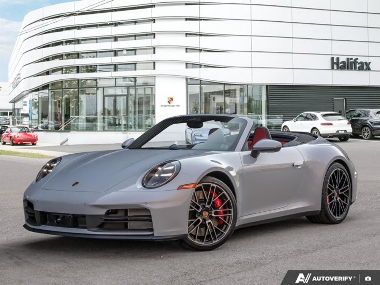This 2026 Porsche 911 Carrera 4S Cabriolet, now available at Porsche Of Halifax, is finished in Ice Grey Metallic with a Leather Interior in Black/Bordeaux Red and is equipped with a PDK transmission.Powertrain and Drivetrain3.0-litre twin-turbocharged flat-6 engine producing 473 horsepower and 390 lb-ft of torquePDK transmissionPorsche Traction Management (PTM) all-wheel driveExteriorIce Grey MetallicCabriolet Roof in Black20/21 911 Turbo S Design WheelsHD-Matrix Design LED HeadlightsModel Designation on Rear in High Gloss BlackSport Exhaust System incl. Tailpipes in BlackExclusive Design Fuel CapFront Axle Lift SystemWheel Center Caps with Colored Porsche CrestUnder Door Puddle Light ProjectorsInterior and SeatingLeather Interior in Black/Bordeaux RedAdaptive Sport Seats Plus (18-way) with Memory PackageVentilated Seats (Front)Heated GT Sport Steering Wheel in LeatherPorsche Crest on Headrests (Front)Pedals and Footrest in AluminumIonizerStorage Net in Passenger FootwellTechnology and Driver AssistanceBurmester® High-End Surround Sound SystemSurround View with Active Parking SupportLane Change Assist (LCA)Adaptive Cruise Control (ACC)Sport Chrono PackagePower Steering PlusPreparation for Porsche Dashcam (Front)This 911 Carrera 4S Cabriolet is configured with a twin-turbocharged all-wheel-drive powertrain, open-top driving capability, and a combination of performance, comfort, and advanced driver assistance features.Visit www.porscheofhalifax.com or call (902)453-8800 to speak with a Porsche Sales Executive.