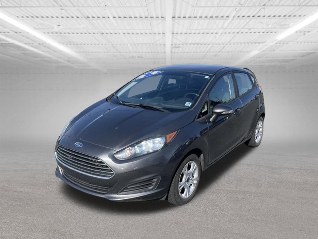 Just added to our AS IS section (wholesale to the public).Buy it before it hits the auction at a wholesale price plus admin fee and taxes.Please note: Not Motor Vehicle Inspected (MVI) No warrantyWe do provide a vehicle check on these vehicles to give you an idea of the work required for MVI, however, buyer is responsible to confirm required repairs.Only on the lot for a limited time, do not miss out.Please note: We only sell to retail customers, no dealers pleaseTRADE INS ARE WELCOME.The 2016 Ford Fiesta SE is a stylish and fuel-efficient compact car that offers a comfortable ride, modern technology, and practical everyday performance. Powered by a responsive 1.6-liter 4-cylinder engine, the Fiesta SE delivers an excellent balance of power and fuel economy, making it an ideal choice for commuting, city driving, and long-distance travel.The SE trim adds desirable features such as power windows and locks, keyless entry, cruise control, air conditioning, Bluetooth connectivity, steering wheel-mounted audio controls, and Fords SYNC infotainment system. The interior is well-designed with supportive seating, ample storage space, and a user-friendly dashboard layout.Known for its agile handling and compact size, the 2016 Fiesta SE is easy to maneuver and park while still providing a comfortable driving experience. With its attractive exterior styling, reliable performance, and efficient fuel consumption, the Ford Fiesta SE remains a popular choice for drivers seeking an affordable and dependable compact vehicle.