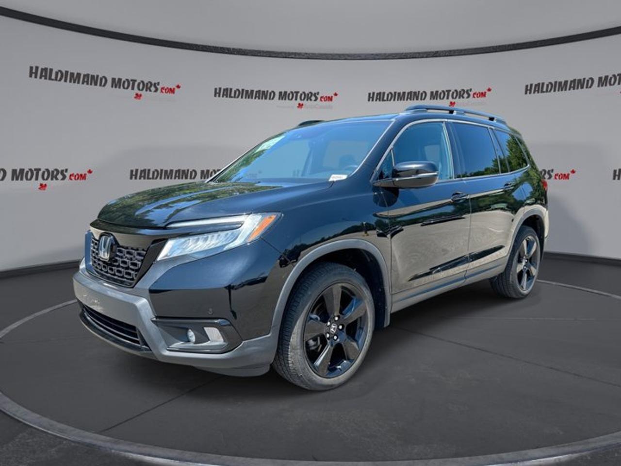 // ACCIDENT FREE!! //<br /><br />Meet the 2020 Honda Passport Touring AWD, a roomy midsize SUV built for busy family life, long highway drives, and weekend escapes. This accident-free example at Haldimand Motors Ltd. in Cayuga pairs a bold black exterior with a black interior, a strong 3.5-litre gas engine, and a smooth automatic transmission.<br /><br />With 108,605 km, this used 2020 Honda Passport Touring AWD still brings the comfort, power, and smart features many drivers want every day. Its 4-door layout, all-wheel drive confidence, and well-equipped Touring trim make it a practical choice for drivers who value space, ease, and year-round capability.<br /><br />FEATURES OF THE Passport Touring AWD | No Accidents | Vent. Front Seats<br />   Ventilated front seats add summer comfort<br />   Power liftgate helps with daily loading<br />   Navigation system guides every trip clearly<br />   Heated rear seats boost passenger comfort<br /><br />ADVANCED SAFETY FEATURES<br />   Backup camera helps with tight parking<br />   Blind spot monitor adds lane confidence<br />   Lane departure warning supports safer travel<br />   Stability control helps maintain road grip<br /><br />PERFORMANCE AND EFFICIENCY<br />   3.5-litre gas V6 delivers strong response<br />   Automatic transmission shifts smoothly every drive<br />   All-wheel drive adds all-season traction<br />   Limited slip differential aids road control<br /><br />COMFORT AND CONVENIENCE<br />   Heated front seats for cold mornings<br />   Ventilated front seats cool warm days<br />   Dual-zone climate control improves cabin comfort<br />   Remote starter adds everyday convenience<br /><br />TECHNONOLGY AND CONNECTIVITY<br />   Apple CarPlay keeps apps close by<br />   Android Auto supports easy phone access<br />   Bluetooth integration supports hands-free calling<br />   WiFi hotspot helps keep devices connected<br /><br />CARGO SPACE<br />   Power liftgate makes loading more convenient<br />   Rear trunk access simplifies daily use<br />   Four-door design supports easy entry<br />   Spacious cabin suits trips and errands<br /><br />AWARDS & RECOGNITIONS<br />   Top Safety Pick, Insurance Institute for Highway Safety, 2020<br /><br />WHAT OTHER OWNERS LIKE<br />   Smooth V6 power for highway passing<br />   Spacious interior for family road trips<br />   Comfortable ride in daily driving<br />   User-friendly controls and smart storage<br /><br />The 2020 Honda Passport Touring AWD is designed for drivers who want more than basic transportation. It gives you strong V6 performance, the added grip of AWD, and a cabin filled with useful comfort features. Heated front and rear seats, a heated steering wheel, dual-zone automatic climate control, and rear climate control help everyone stay comfortable in changing Canadian weather.<br /><br />This 2020 Honda Passport Touring AWD also makes daily driving easier with practical details that matter. A power drivers seat with lumbar support, memory seats, memory mirrors, power windows, heated mirrors, retractable mirrors, push-button start, cruise control, and power steering all help create a simple and relaxed driving experience.<br /><br />For entertainment and information, this SUV is well prepared. The navigation system, satellite radio, HD Radio, Bluetooth integration, Apple CarPlay, Android Auto, steering wheel audio controls, and auto-dimming rearview mirror help keep each drive connected and easy to manage. The layout is simple to use, which is a major plus on busy days.<br /><br />On the outside, the black finish gives this Passport a clean and upscale look. Fog lights, LED headlamps, tinted windows, a rear spoiler, turn signal mirrors, and a sunroof add style and function without going over the top. This is an SUV that looks ready for work, travel, and family life.<br /><br />If you want a capable and comfortable SUV with proven Honda durability, this 2020 Honda Passport Touring AWD stands out as a smart pick. It offers the features drivers use most, solid road manners, and the peace of mind of an accident-free history.<br /><br />This 2020 Honda Passport Touring AWD | No Accidents | Vent. Front Seatss VIN is: 5FNYF8H94LB501711.<br /><br />WHY CHOOSE US? <br /><br />Honest & Transparent Buying Experience: Weve been a trusted name in business since 1984.<br /><br />STRAIGHTFORWARD PRICING:<br />Our Advertised Price Includes:<br />>>Safety Certification (No separate fee!)<br />>>30-Day 100% Mechanical Warranty<br />>>FREE Carfax History Report.<br />>>No upcharge for paying cash.<br />(Prices Exclude HST and Licensing Fees only.)<br /><br />>>Browse 300+ vehicles all in ONE LOCATION<br /><br />EASY FINANCING: Great rates & open loans<br /><br />WE BUY CARS: Get Top Dollar for your trade-in, or sell us your vehicle for CASH! Even if you dont buy from us!<br /><br />STOP BY TODAY<br />Treat yourself - stop by Haldimand Motors Ltd. located at 42 Talbot St E, Cayuga, ON N0A 1E0 to make this car yours today!<br /><br />https://www.haldimandmotors.com/used/stock-460991.html