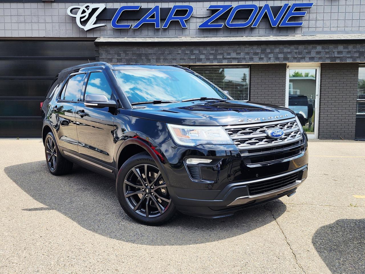 <p>Looking for a versatile and spacious SUV that can handle whatever your busy Canadian life throws at it? Car Zone has the perfect vehicle for you: a sleek, black 2018 Ford Explorer XLT. This rugged yet refined SUV is designed to comfortably seat up to seven passengers, making it ideal for family road trips, carpooling, or simply having extra room for all your adventures. The luxurious black leather interior not only looks stunning but also provides a premium feel for every drive, ensuring comfort for everyone on board.</p><p>Under the hood, this Explorer is powered by a robust 3.5L V6 engine, delivering the performance and capability you need, especially with its reliable 4-wheel drive system thats perfect for tackling diverse Canadian weather conditions. Whether youre navigating city streets or venturing off the beaten path, this Ford Explorer is ready. With 131,809 kilometers on the odometer, its a well-seasoned vehicle thats still eager to provide many more miles of dependable service.</p><p>Here are five features that make this 2018 Ford Explorer XLT a standout choice:</p><ul><li><strong>7-Passenger Seating:</strong> Unmatched versatility for bringing the whole crew along on every outing.</li><li><strong>Luxurious Leather Interior:</strong> Experience premium comfort and a sophisticated feel on every journey.</li><li><strong>Powerful 3.5L V6 Engine:</strong> Enjoy ample power and smooth performance for confident driving.</li><li><strong>4-Wheel Drive Capability:</strong> Conquer any road condition with enhanced traction and control, essential for Canadian winters.</li><li><strong>Spacious SUV/Crossover Body Style:</strong> Plenty of cargo room and passenger space for all your gear and loved ones.</li></ul><p>Looking for Your Dream Car? Call Car Zone Today!</p><p>Thanks for viewing our Car Zone inventory. All of our vehicles come fully detailed with a Carfax and a mechanical fitness assessment. Drive this home today! Easy financing options. All credit welcome. APPLY NOW We even take trades. Same day approvals at CARZONECALGARY or visit us in person at 2036 36 Street SE Calgary for a hassle free test drive. Let our friendly team of experts book an appointment with you and show you the Car Zone difference! AMVIC licensed dealer.&nbsp;</p>