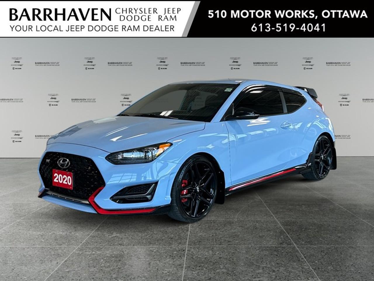 Experience the thrill of driving the 2020 Hyundai Veloster N, featuring a striking hatchback design and manual transmission that puts you in full control of its dynamic front-wheel drive (FWD). Offering a bold presence on the road, its captivating style is matched by performance-oriented handling, ensuring every drive is an exhilarating journey. Step inside to enjoy a thoughtfully designed interior where comfort meets sportiness. The Hyundai Veloster N is equipped with heated seats and a leatherette door trim insert, complemented by a leather steering wheel and a unique leather/metal-look gear shifter. The spacious cabin is not just about comfort but also about convenience, featuring keyless entry, power windows, and a remote start option. Stay connected and entertained with advanced technology like a smart device integration, navigation system, and Bluetooth connection seamlessly offered alongside a satellite radio. Safety and driver assistance features include a reliable backup camera and brake assist, all designed to enhance your driving experience and provide peace of mind. Perfect for driving enthusiasts and tech-savvy individuals who cherish both style and functionality, the 2020 Hyundai Veloster N awaits you. Contact Barrhaven Jeep Dodge Chrysler Ram to learn more and to make this distinctive vehicle yours today! FREE CARFAX, NO ADMIN FEES, NON SMOKER, CERTIFIED PRICE PLUS TAX ONLY!!