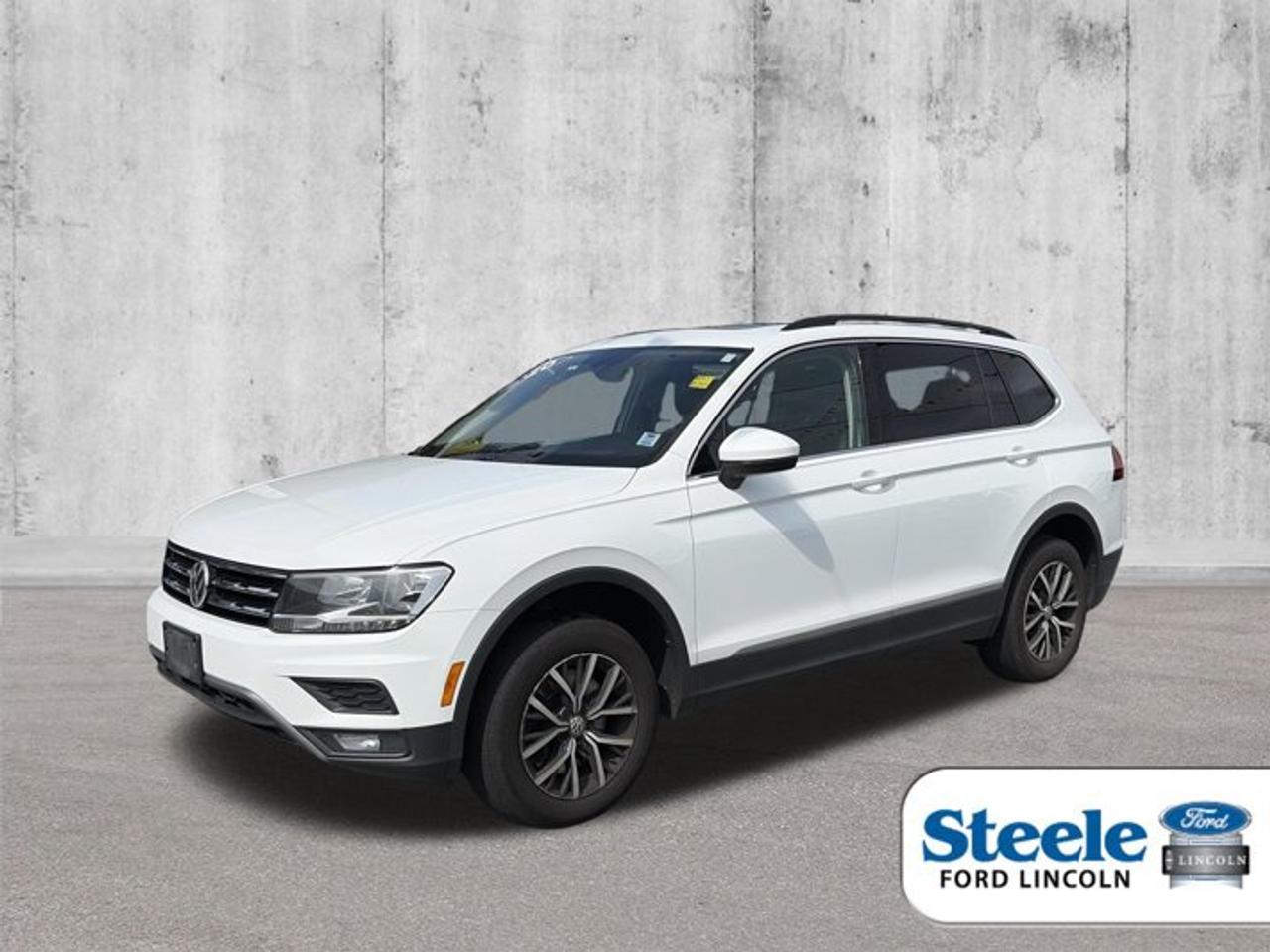 Meet the 2020 Volkswagen Tiguan, a used SUV now available at Steele Ford Lincoln in Halifax. Finished in White with four doors, this compact sport utility vehicle offers a smart mix of everyday utility, turbocharged performance, and all-weather confidence. With 124,288 km on the odometer, the 2020 Volkswagen Tiguan remains a practical choice for drivers who want flexible space and refined road manners.The 2020 Volkswagen Tiguan is powered by a 2.0-litre intercooled turbocharged four-cylinder gas engine paired with an automatic transmission. Its all-wheel drive system helps deliver added traction in changing Atlantic Canadian weather. This setup gives the 2020 Volkswagen Tiguan solid versatility for city errands, highway travel, and weekend plans around Halifax and beyond.FEATURES OF THE Tiguan»» Turbocharged 2.0-litre four-cylinder gas engine»» Automatic transmission for smooth daily driving»» All-wheel drive for added traction»» Four-door SUV with versatile utilityADVANCED SAFETY FEATURES»» Electronic stability control supports confident handling»» Anti-lock braking system helps controlled stops»» Traction control assists on slippery roads»» Tire pressure monitoring aids awarenessPERFORMANCE AND EFFICIENCY»» Turbo engine delivers responsive everyday power»» Automatic transmission shifts smoothly and efficiently»» All-wheel drive adds year-round confidence»» Balanced ride suits city highwaysCOMFORT AND CONVENIENCE»» Four doors allow easy passenger access»» Spacious cabin supports daily family use»» SUV design helps comfortable entry»» Flexible layout suits busy lifestylesTECHNOLOGY AND CONNECTIVITY»» Clear driver controls support easy operation»» Useful displays keep information visible»» Modern vehicle design feels user-friendly»» Practical cabin layout supports convenienceCARGO SPACE»» Rear cargo area suits errands»» SUV shape supports versatile packing»» Useful space for travel gear»» Roomy layout helps everyday haulingAWARDS & RECOGNITIONS»» Top Safety Pick, Insurance Institute for Highway Safety, 2020»» Best Compact SUV for Families, U.S. News, 2020WHAT OTHER OWNERS LIKE»» Confident all-wheel drive in poor weather»» Smooth turbo power for daily driving»» Practical cargo room for families»» Comfortable ride for longer tripsThis used 2020 Volkswagen Tiguan stands out with the right blend of utility, efficiency, and confidence for Canadian driving. Its turbocharged engine brings lively response, while the automatic transmission keeps every trip smooth and simple. The all-wheel drive system is a strong advantage for drivers in Halifax who face rain, snow, and changing road conditions throughout the year.For shoppers looking for a compact SUV with trusted Volkswagen engineering, the 2020 Volkswagen Tiguan is easy to appreciate. Its White exterior gives it a clean, timeless look, and its practical four-door layout makes loading passengers and gear easy. Whether it is commuting, school runs, or weekend travel, this SUV is ready to handle daily life with confidence.This 2020 Volkswagen Tiguans VIN is: 3VV2B7AX0LM170448.
