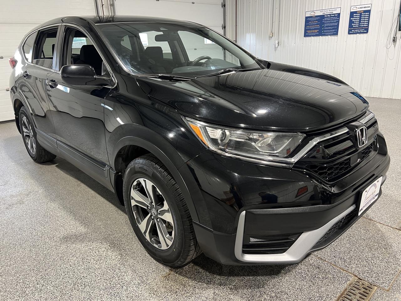 <p data-start=0 data-end=517>Confidence Meets Everyday Practicality</p><p data-start=0 data-end=517><br data-start=42 data-end=45> Experience comfort, reliability, and all-weather capability with this 2021 Honda CR-V LX AWD! Powered by a dependable 2.4L engine paired with a smooth automatic transmission, this SUV delivers excellent fuel efficiency and a refined driving experience thats perfect for everything from daily commuting to weekend road trips. Hondas AWD system provides added confidence and traction, helping you tackle changing road and weather conditions throughout the year.<span aria-hidden=true></span></p><p data-start=519 data-end=1186>Inside, the CR-V offers a spacious and thoughtfully designed cabin built for everyday comfort. Heated front seats help keep you warm during colder mornings, while dual-zone climate control allows both driver and passenger to enjoy personalized comfort. Remote start, push-button start, and keyless entry add convenience to your daily routine, making every drive effortless. Stay connected with Bluetooth and USB connectivity, along with Apple CarPlay and Android Auto integration through the intuitive touchscreen infotainment system. The backup camera provides added confidence when reversing and parking, making maneuvering easier wherever you go.</p><p data-start=1188 data-end=1653>Hondas advanced safety technology helps give you peace of mind on every journey. Equipped with adaptive cruise control, lane keep assist, lane follow assist, and automatic high beams, this CR-V is designed to make highway driving safer and more relaxing. Spacious, efficient, and packed with practical features, this 2021 Honda CR-V LX AWD is an excellent SUV for drivers looking for reliability, comfort, and modern technology in one versatile package.</p><p data-start=1655 data-end=2105>At Sisson Auto, we make buying a vehicle a seamless and stress-free experience. Our transparent pricing eliminates haggling and eliminates any hidden fees. To give you peace of mind, we offer a 3-day/600 km No-Hassle Return Policy, a 30-day exchange privilege, minimum warranties with 24-hour roadside assistance, a check for safety recalls, and a complimentary CarFax history report. Plus, home delivery is free within 200 km. Dealer permit #5471.</p><p> </p><p data-start=2107 data-end=2292 data-is-last-node= data-is-only-node=>** This description was written by AI based on information provided about the vehicle. AI can sometimes produce incorrect information. Please confirm all details with the dealership. **</p>