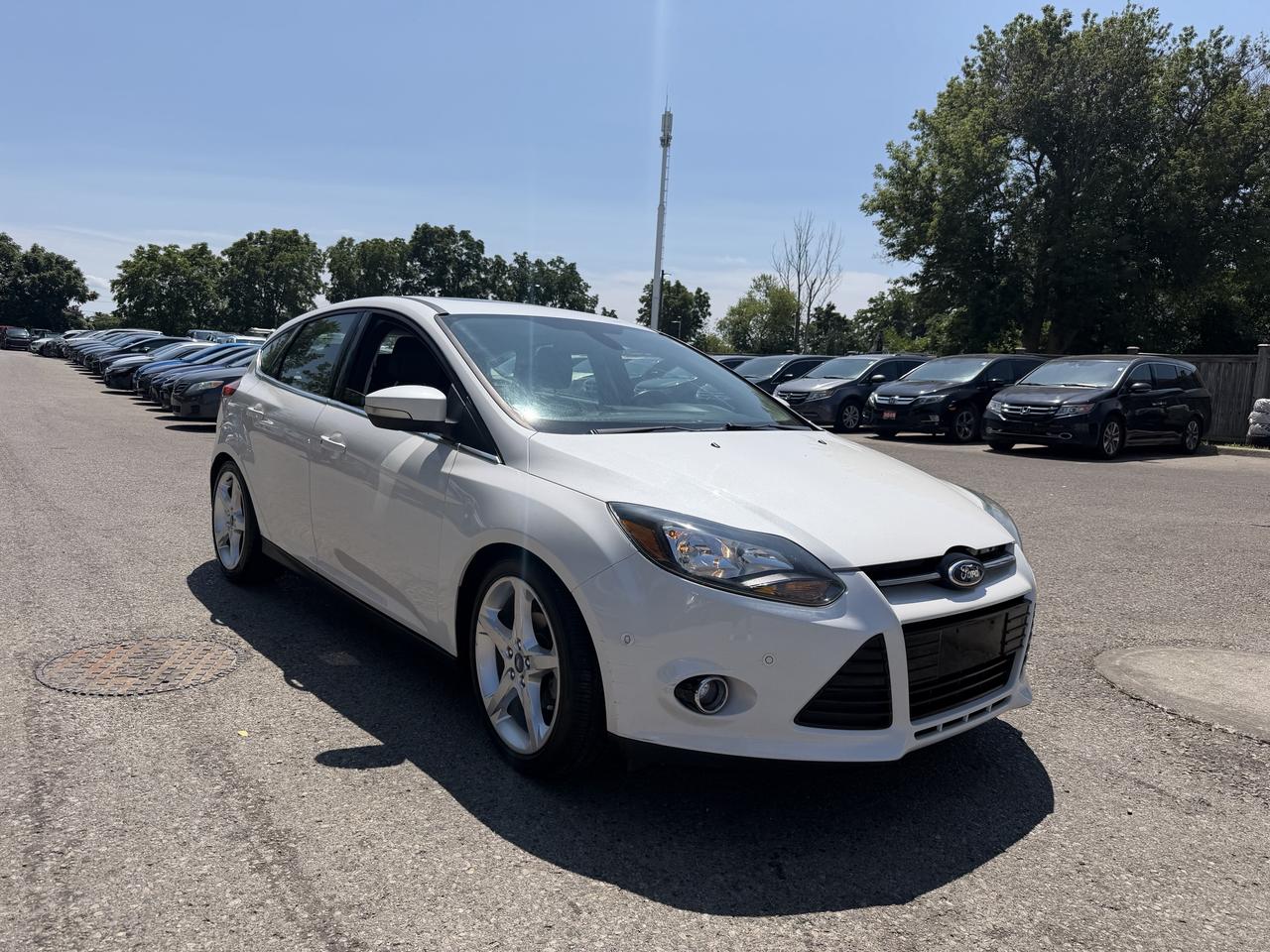 <p>Experience the perfect blend of style and practicality with this stunning white 2012 Ford Focus Titanium sedan, now available at Target Auto Centre. Step inside to discover a sophisticated black interior, offering a comfortable and refined driving environment. Under the hood, a robust 2.0L I4 engine paired with an automatic transmission delivers a smooth and efficient ride, while the front-wheel drive ensures responsive handling. This Focus Titanium isnt just a car; its a smart choice for those seeking dependable performance and a touch of luxury.&nbsp;This 2012 Ford Focus Titanium is equipped to impress. The Titanium trim signifies a higher level of refinement and technology, making it a standout in its class. With its four doors and spacious sedan body style, its an ideal vehicle for everyday commutes, family outings, or weekend adventures. The Flex Fuel capability offers you the flexibility to choose your fuel option, adding an extra layer of convenience.</p><p>&nbsp;</p><hr><p>&nbsp;</p><p dir=ltr><strong>CERTIFIED PRE-OWNED VEHICLE | BUY WITH CONFIDENCE</strong></p><p dir=ltr>&nbsp;- Ontario Safety Standards Certificate Included<br>- 30 Day / 1,000 KM Safety Warranty Included<br>- Fully Detailed Prior to Delivery<br>- CARFAX Vehicle History Report Available<br>&nbsp; (View on Our Website)</p><p>&nbsp;</p><hr><p>&nbsp;</p><p dir=ltr><strong>VALUE AND TRANSPARENCY | WHY CHOOSE US</strong></p><p dir=ltr>- Price Plus HST & Licensing Only<br>- No Additional Fees | All-In Pricing<br>- Same Price Cash or Finance<br>- Extended Warranty Protection Plans Available<br>- Autotrader Best Priced Dealer Award (2024)<br>- Competitive Market Value on Trade-ins<br>- We&rsquo;ll Buy Your Car &mdash; No Purchase Required<br>- Know Someone Looking For a Vehicle? Get a Referral Award<br>- Open 7 Days a Week</p><p>&nbsp;</p><hr><p>&nbsp;</p><p dir=ltr><strong>ABOUT TARGET AUTO CENTRE</strong></p><p dir=ltr>Target Auto Centre has been proudly serving London, Ontario and surrounding areas for over 20 years, offering over 150 quality pre-owned vehicles and a constantly updated selection to choose from. We focus on providing competitive pricing, clear information, and a straightforward buying process so you know exactly what to expect from start to finish.</p><p dir=ltr>Cars For Everyone! We offer a wide selection of vehicles to fit every lifestyle, need, and budget. Our inventory includes cars, trucks, SUVs, and vans from trusted brands such as Ford, Chevrolet, Toyota, Honda, Nissan, BMW, Mercedes-Benz, Audi, Lexus, Acura, Hyundai, Kia, Mazda, Volkswagen, Jeep, RAM, GMC, Subaru, and more. With new arrivals regularly, there&rsquo;s always something for everyone.</p><p dir=ltr>As a proud member of the Used Car Dealers Association of Ontario (UCDA), we are committed to operating with honesty, transparency, and professionalism in every transaction. Our goal is to make your vehicle purchase as simple and stress-free as possible, while delivering the level of service our customers continue to trust. Come visit us today and see why were the preferred choice for pre-owned vehicles in London and the surrounding areas. We look forward to earning your business!</p>