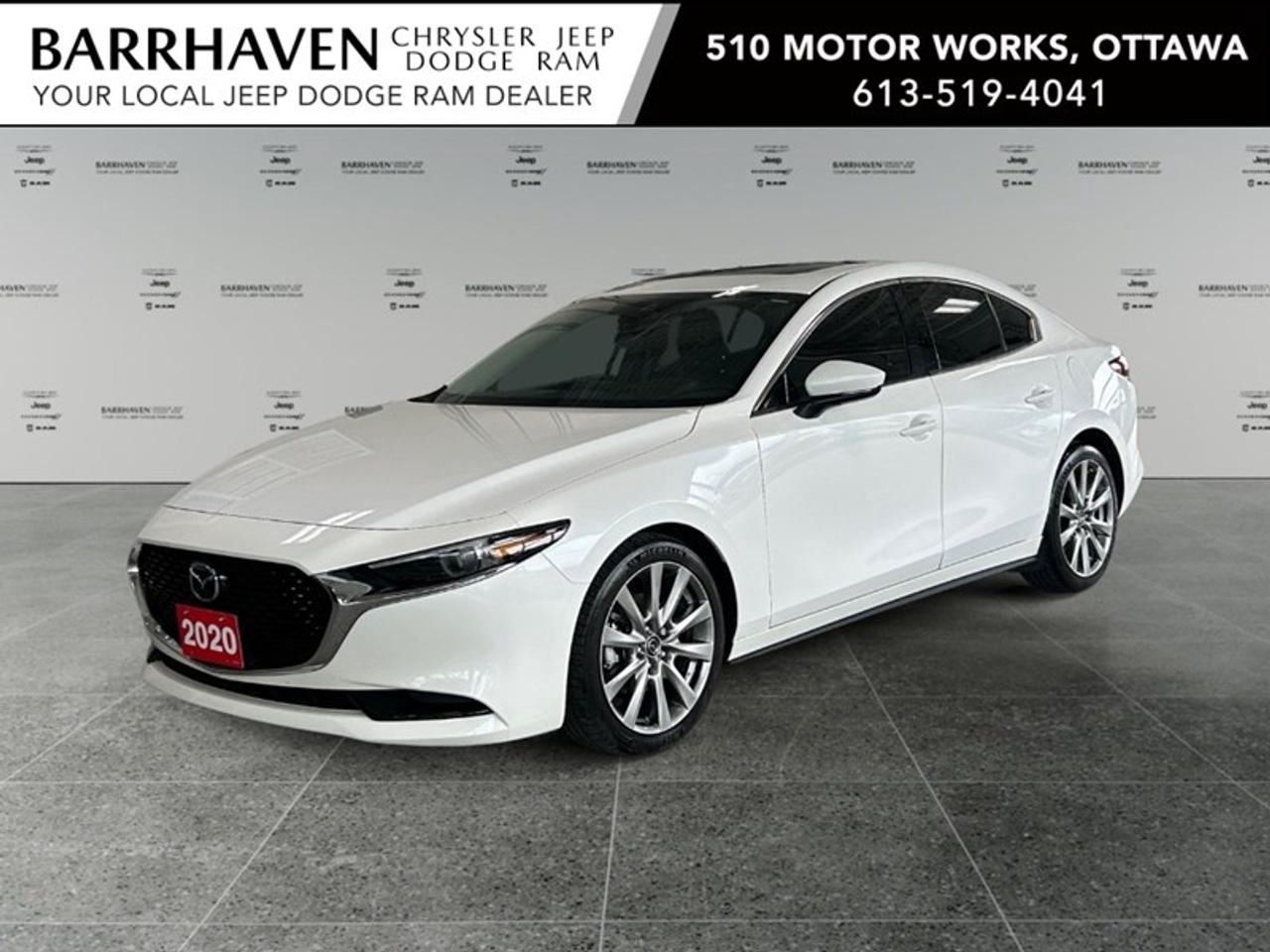 The 2020 Mazda Mazda3 GT in stunning white and equipped with i-ACTIV AWD is perfect for those who seek a confident drive across any terrain. Its automatic transmission ensures a smooth ride that enhances the driving experience, making every journey a pleasure. As a sedan, the Mazda3 offers a sleek and sophisticated exterior, complemented by stylish alloy wheels. Inside, enjoy the premium feel of the leather seats and the convenience of power seats and windows. The spacious interior offers a touch of luxury with a sunroof/moonroof, setting the stage for both comfort and elegance. Technology is prevalent with a user-friendly navigation system and a heads-up display, making it easy to keep your focus on the road. Safety features like lane assist, adaptive cruise control, and parking sensors provide you with confidence and peace of mind on any journey. This car is the perfect match for tech-savvy drivers who value style, comfort, and safety in their daily commute or weekend getaways. With features like a heated steering wheel and smart device integration, youre ensured a well-connected and comfortable drive every time. If this sounds like your kind of ride, contact Barrhaven Jeep Dodge Chrysler Ram today to learn more about how you can bring this stylish sedan home.