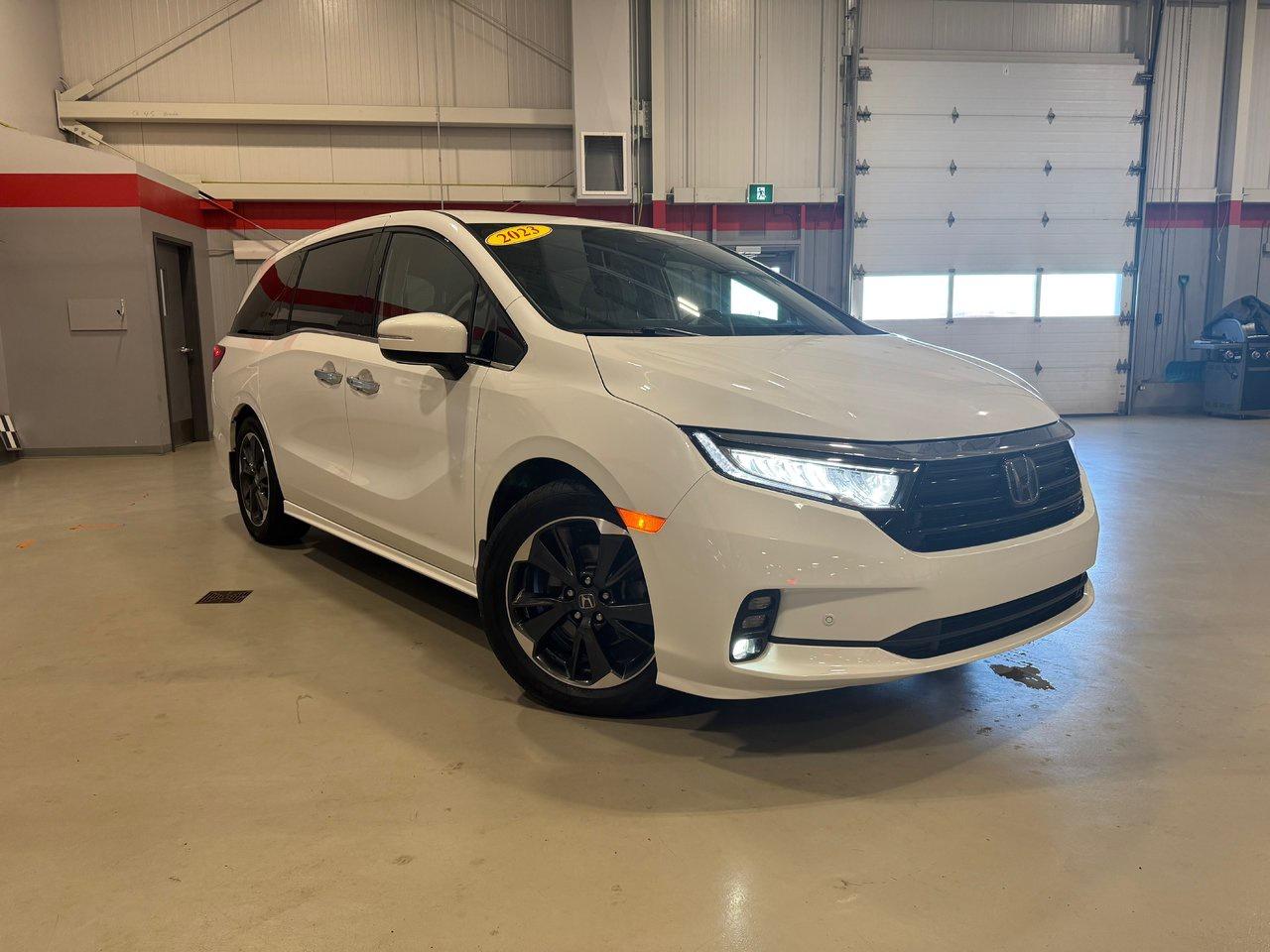 <span>When it comes to family transportation, the Honda Odyssey is the ultimate. And when it comes to Odysseys, this is the pinnacle. This is the 2023 Honda Odyssey Touring. (Want to hear a little secret? The Odyssey is also rather fun to drive.)</span>




<span>This 2023 Honda Odyssey Touring &ndash; rated to tow up to 3,500 pounds, able to seat 8, able to hold over 4,000 litres of cargo behind the front row &ndash; has the on-road behaviour of a midsize sedan. Powerful, with great handling and sharp steering, the V6-engined Odyssey is in another league. Plus its absolutely filled with great tech, convenience, comfort, and safety features.</span>




<span>The Odyssey Tourings upgrades are numerous. Start with the futuristic tech: CabinTalk in-car PA and CabinWatch rear seat monitor. Theres also wireless charging, a power tailgate, LED lighting, blind spot monitoring, rain-sensing wipers, and an 11-speaker 550-watt premium audio upgrade. The Odyssey Touring also adds comfort touches like ventilated front seats, ambient lighting, and acoustic front and rear door glass.&nbsp;</span>




<span>As if there wasnt already enough premium componentry. Standard features already included&nbsp;navigation, leather seating, front and rear parking sensors, an acoustic windshield, memory settings for the drivers power seat, and satellite radio compatibility. Theres a lot more, including tri-zone automatic climate control, power sliding doors, a sunroof, integrated second-row sunshades, heated front seats, and a 12-way power drivers seat.</span>




<span>And, well, theres a lot more beyond that: proximity access/pushbutton start, a multi-angle rearview camera, a power passenger seat, Apple CarPlay/Android Auto, auto high beams, and the brilliant Magic Slide second row seat that makes the Odyssey the most flexible van on the market. Honda Sensing is standard, too, with adaptive cruise control, lane keeping assist, forward collision warning, and more.</span>




<span style=font-weight: 400;>Thank you for your interest in this vehicle. Its located at Centennial Honda, 515 Central Street, Summerside, PEI. We look forward to hearing from you; call us at 1-902-436-9158.</span>