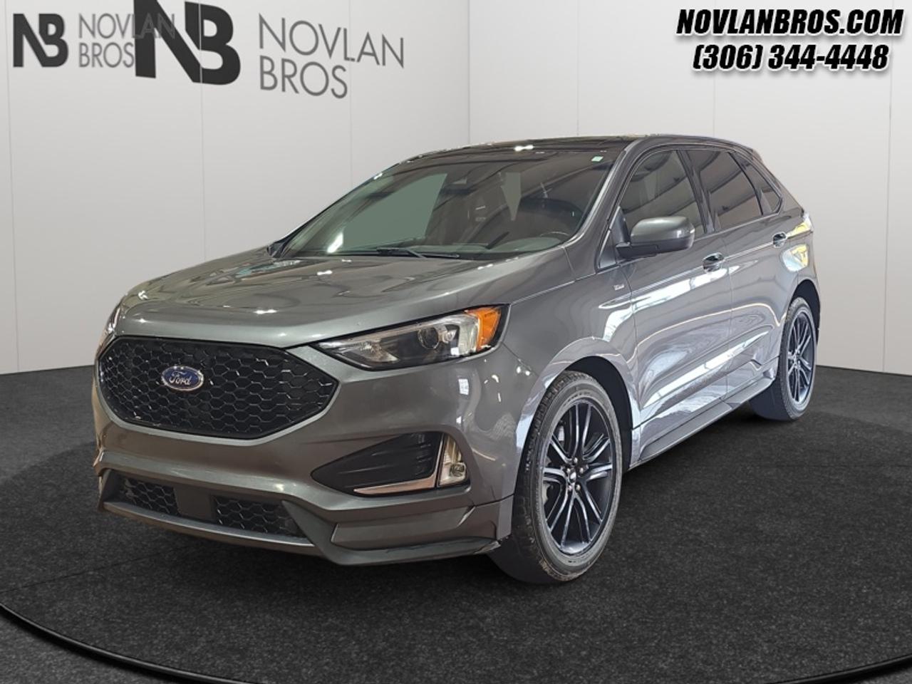 <b>Heated Seats, Navigation, Leather Interior, Remote Engine Start, Rear View Camera!</b><br> <br> Check out our great inventory of pre-owned vehicles at Novlan Brothers!<br> <br>This unique and stylish Ford Edge is here to make waves. This 2022 Ford Edge is fresh on our lot in Paradise Hill.<br> <br>With meticulous attention to detail and amazing style, the Ford Edge seamlessly integrates power, performance and handling with awesome technology to help you multitask your way through the challenges that life throws your way. Made for an active lifestyle and spontaneous getaways, the Ford Edge is as rough and tumble as you are. Push the boundaries and stay connected to the road with this sweet ride!<br> <br>This SUV has 155,729 km. Its Carbonized Grey Metallic in colour. It has a 8 Speed Automatic transmission and is powered by a 250HP 2.0L 4 Cylinder Engine. <br> <br> Our Edges trim level is ST Line. This Ford Edge ST-Line was developed for drivers that value aggressive styling and ultimate fuel economy. More than exclusive styling, you also get ActiveX trimmed seats, SYNC 4 with enhanced voice recognition, larger dark aluminum wheels, SiriusXM and a massive 12 inch touchscreen featuring wireless Apple CarPlay and Android Auto. It also comes with FordPass Connect 4G LTE, heated ActiveX power seats with memory settings, a leather steering wheel with cruise control and audio controls, plus a foot-activated power liftgate! To match safety with performance, this impressive SUV also includes blind spot detection, lane keep assist, front fog lights, rear parking sensors, remote engine start, automatic emergency braking, a rear view camera and so much more! This vehicle has been upgraded with the following features: Heated Seats, Navigation, Leather Interior, Remote Engine Start, Rear View Camera, Reverse Sense System, Bucket Seats.<br> To view the original window sticker for this vehicle view this <a href=http://www.windowsticker.forddirect.com/windowsticker.pdf?vin=2FMPK4J99NBA35893 target=_blank>http://www.windowsticker.forddirect.com/windowsticker.pdf?vin=2FMPK4J99NBA35893</a>. <br/><br> <br>To apply right now for financing use this link: <a href=http://novlanbros.com/credit/ target=_blank>http://novlanbros.com/credit/</a><br> <br/><br>The Novlan family is owned and operated by a third generation and committed to the values inherent from our humble beginnings.<br> Come by and check out our fleet of 20+ used cars and trucks and 100+ new cars and trucks for sale in Paradise Hill.  o~o